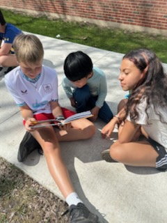 kindergarten buddies reading together