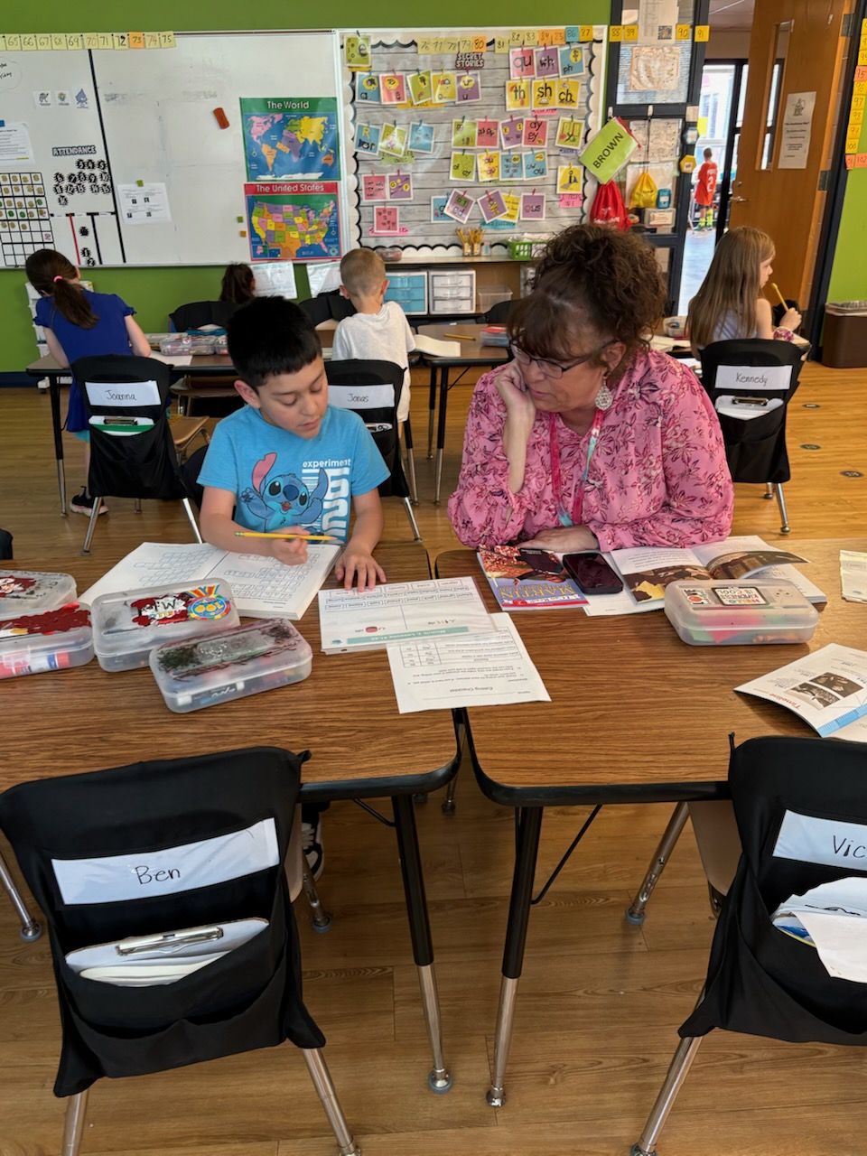 teacher working with student