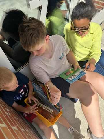 kindergarten buddies reading together