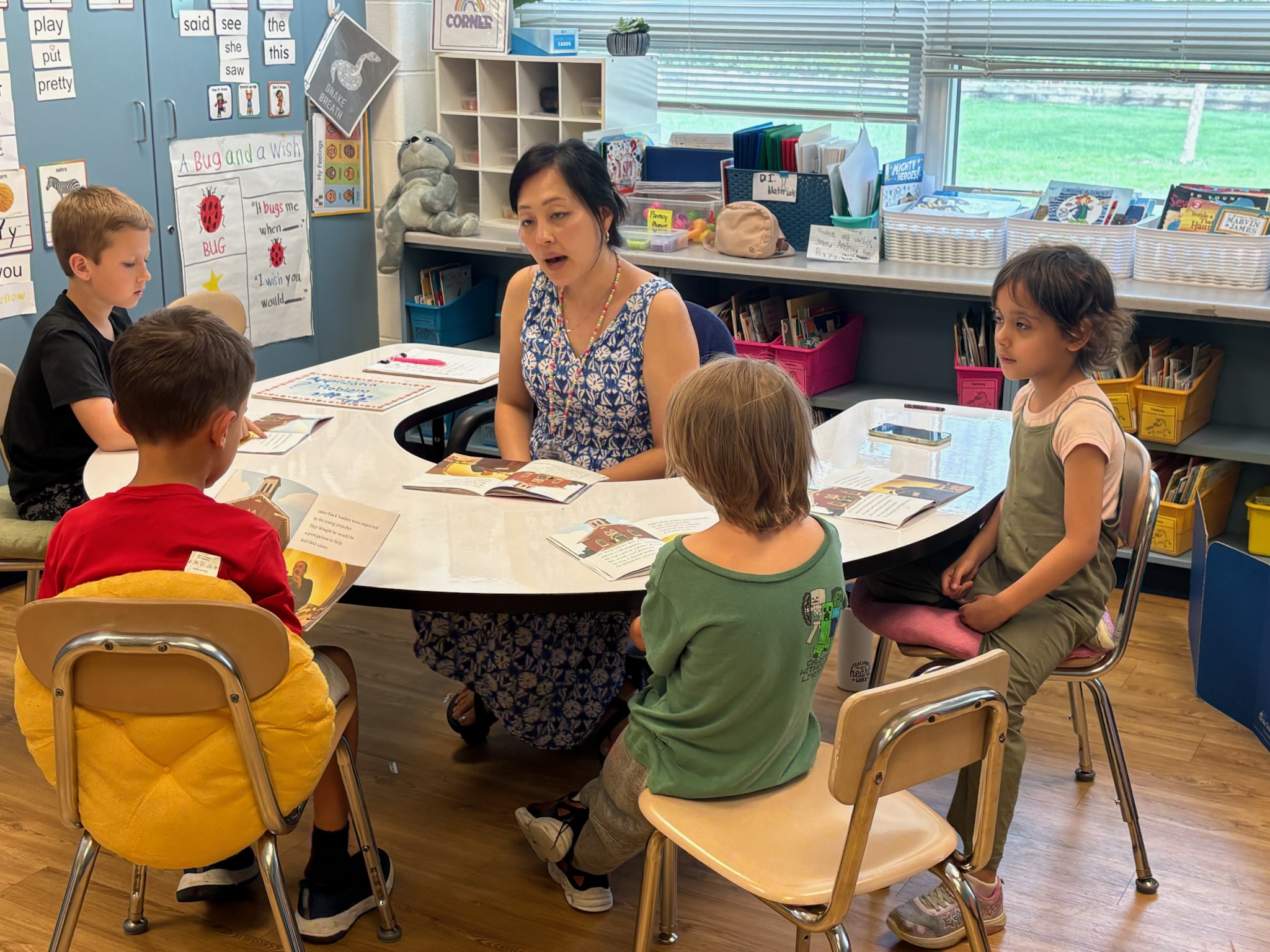 teacher working with student