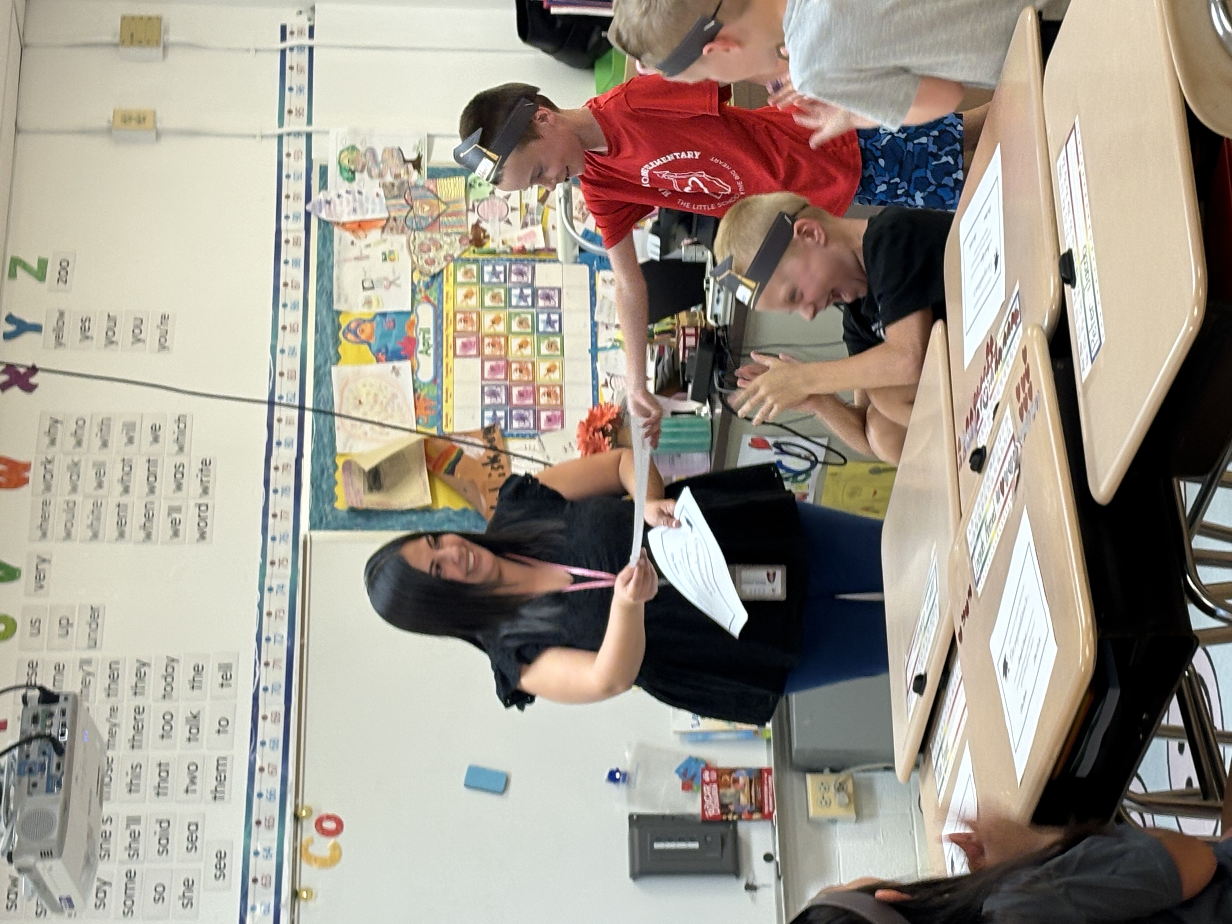 Teacher hands student certificate