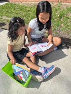 kindergarten buddies reading together