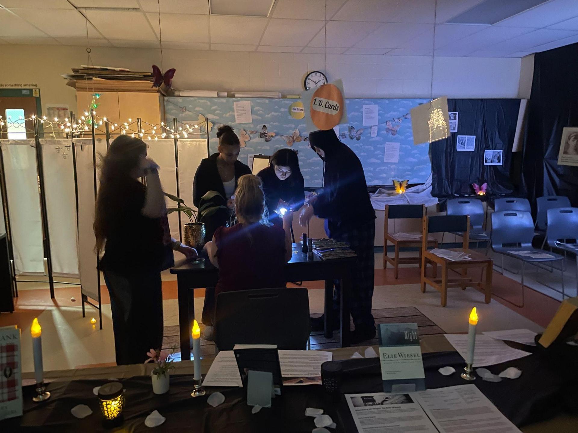 People viewing the Holocaust museum in a Pathways classroom