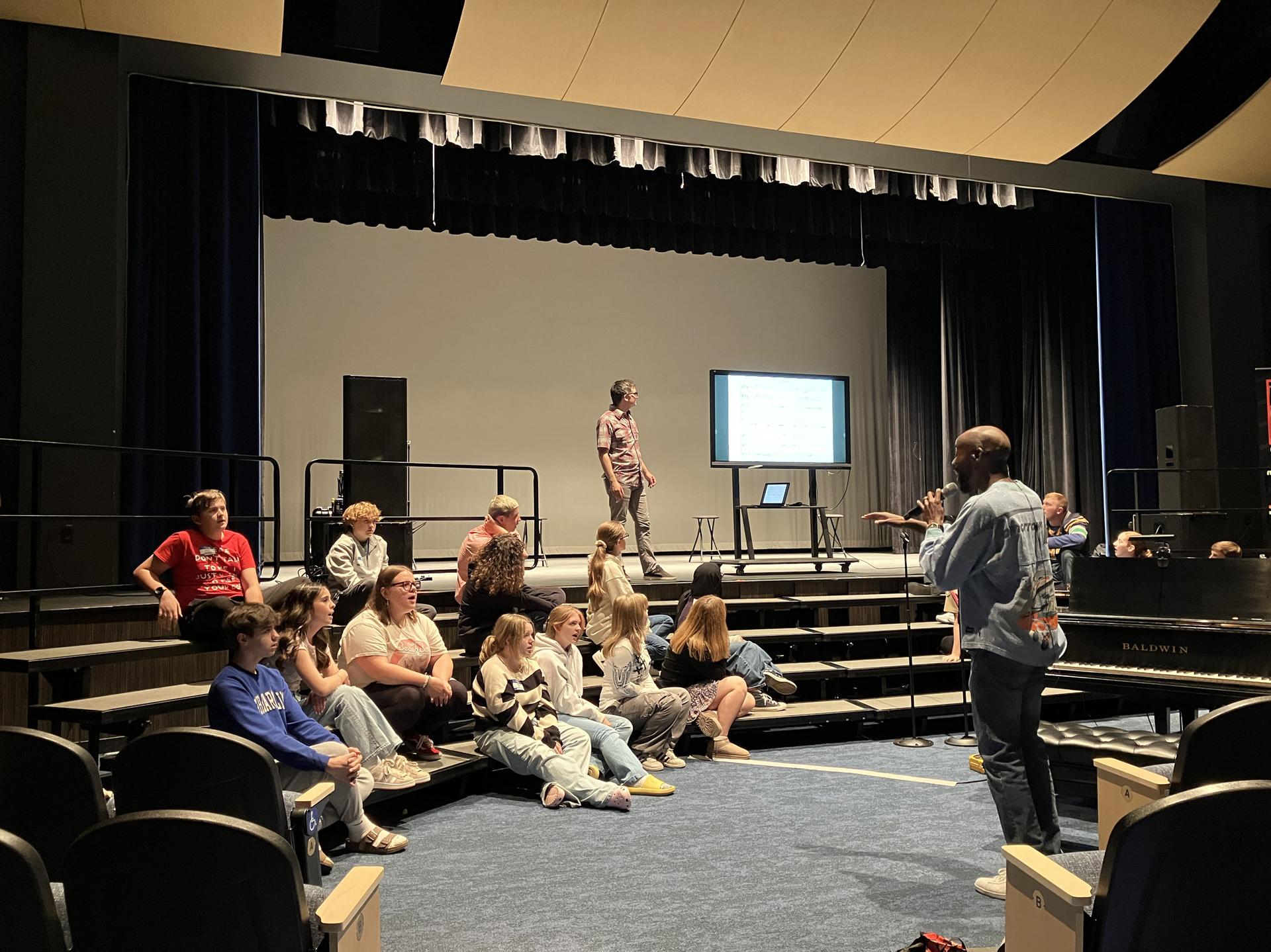 Students and science teacher with space seed capsule and certificate