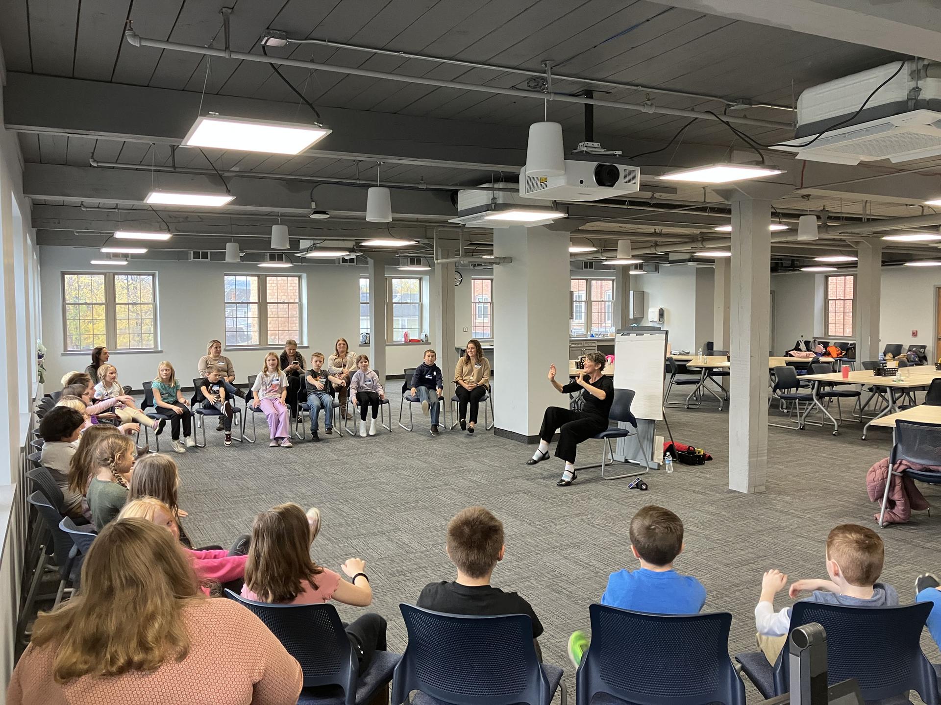 Students and science teacher with space seed capsule and certificate
