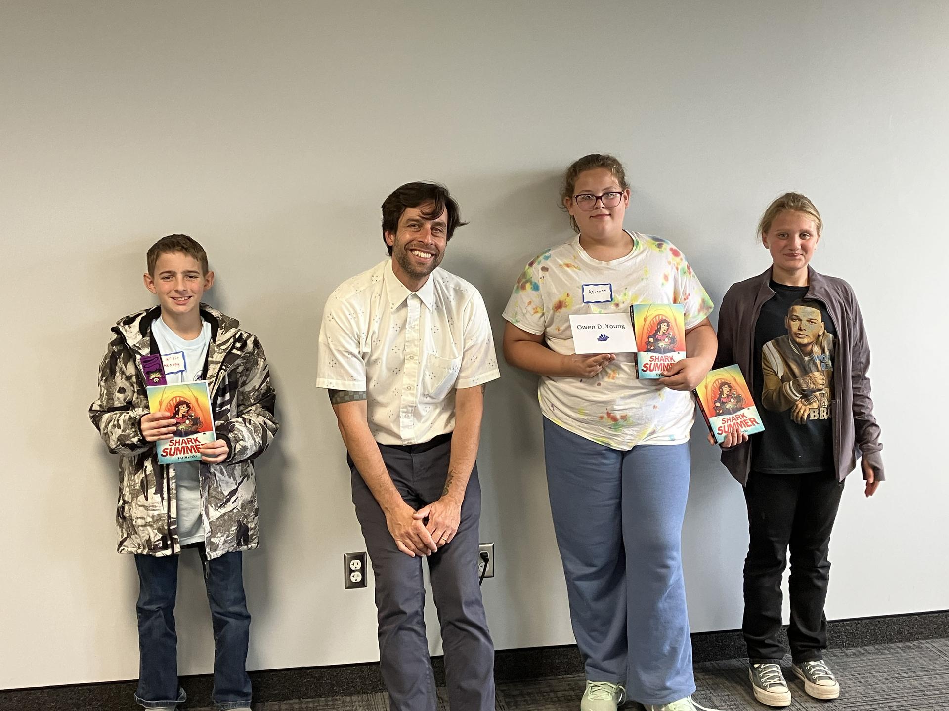 Students and science teacher with space seed capsule and certificate