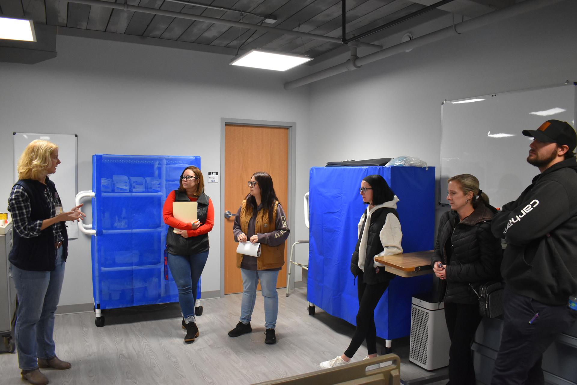 Students and science teacher with space seed capsule and certificate