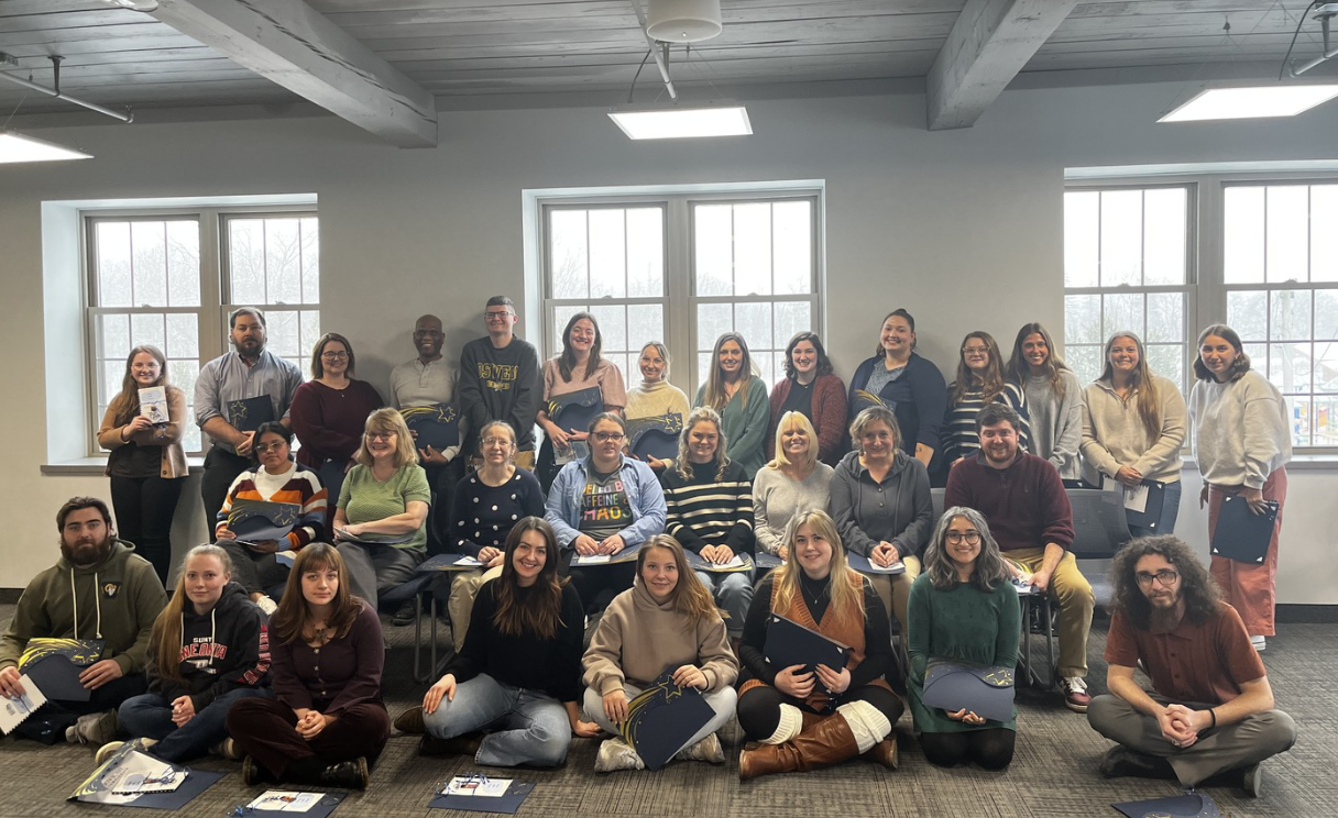 Many teachers posing together at New Teacher Seminar