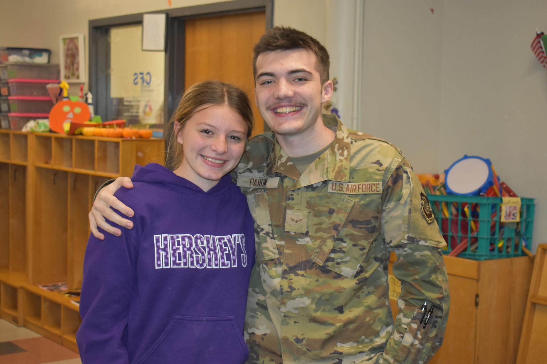 Students and science teacher with space seed capsule and certificate
