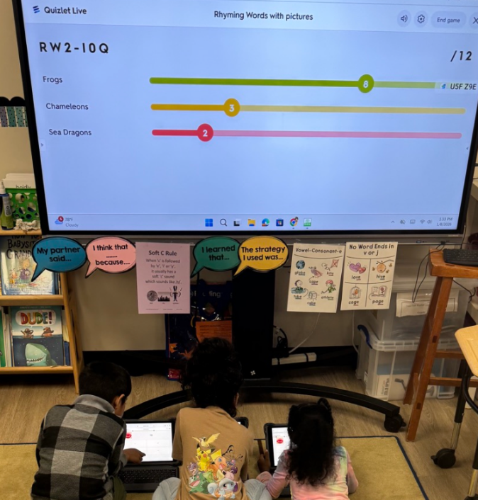 3 students near computer screen