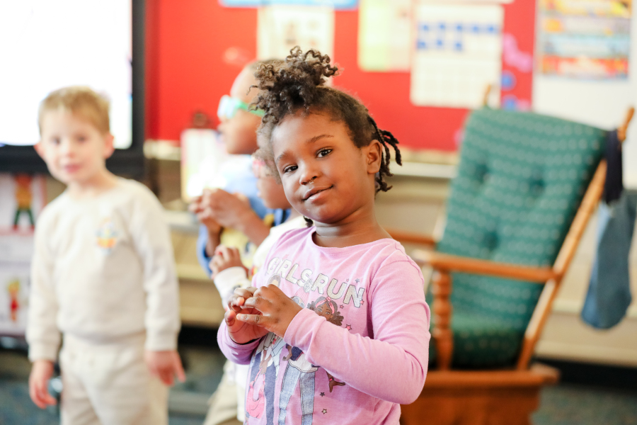 Hallett student smiles at the camera