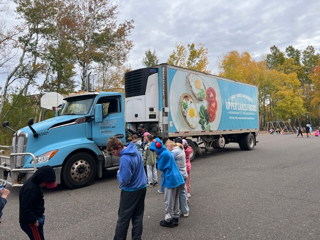 Students standing around an Upper Lakes Foods truck