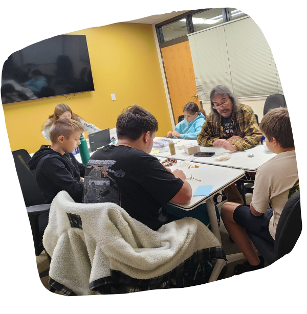 Students making grafts around the table