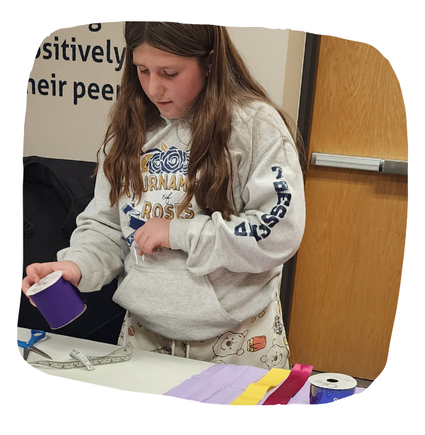Student making a ribbon dress