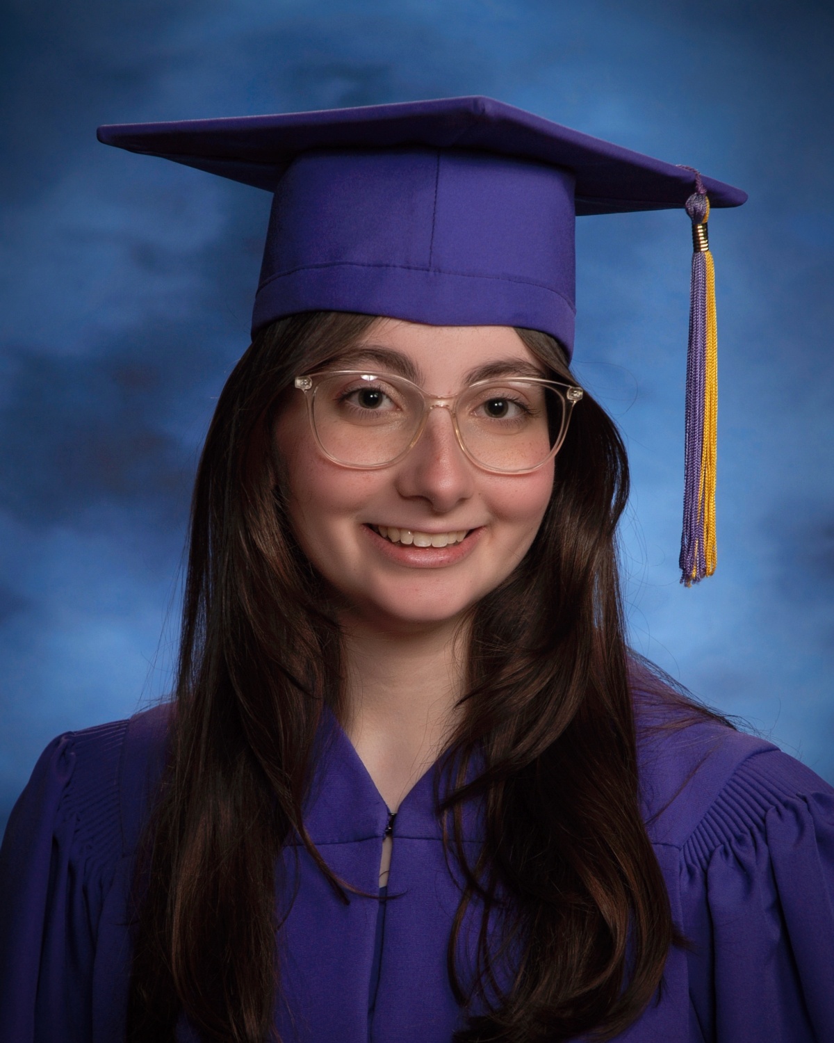 Photo of student wearing a cap and gown.
