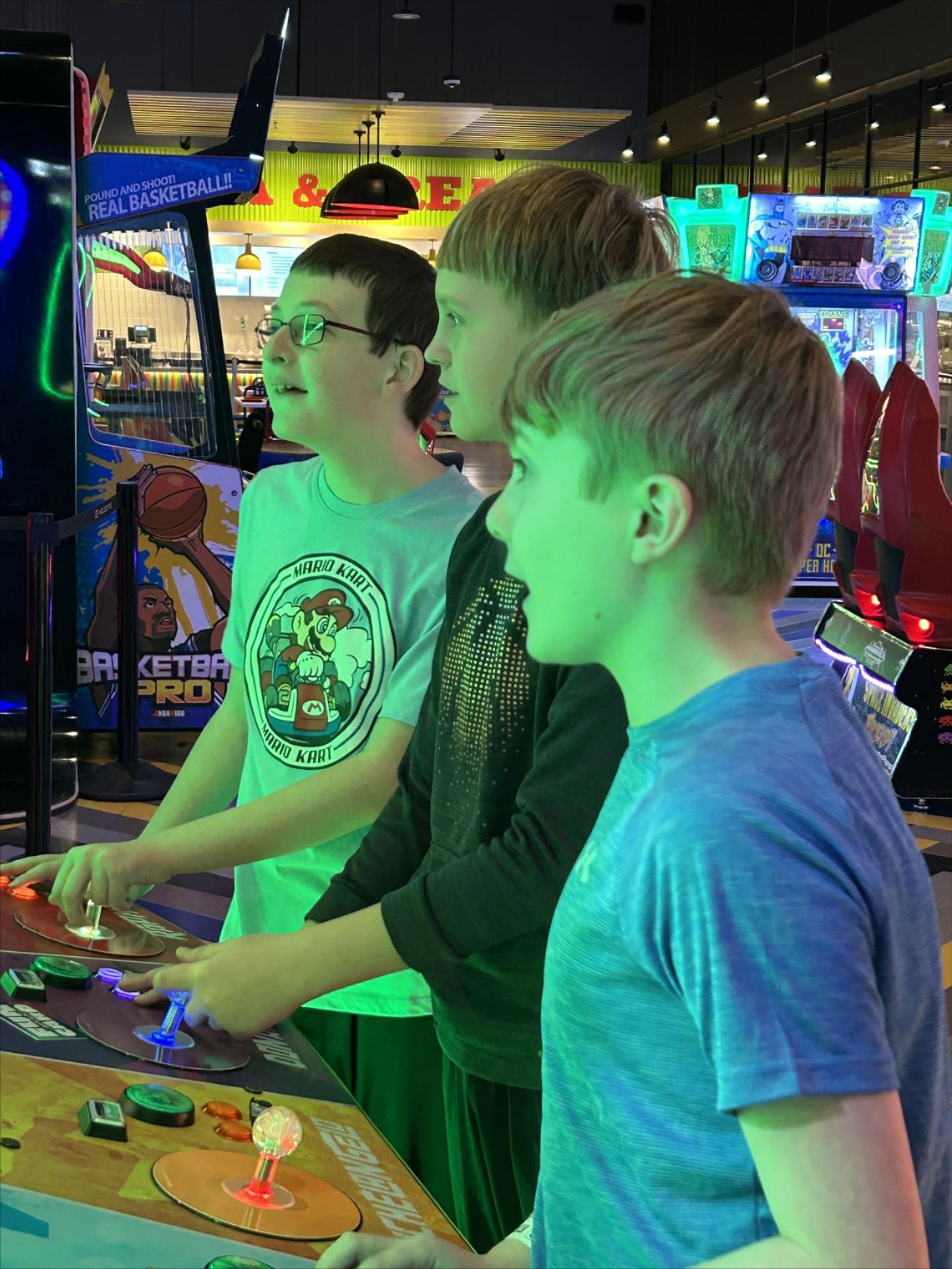 Students playing an arcade game