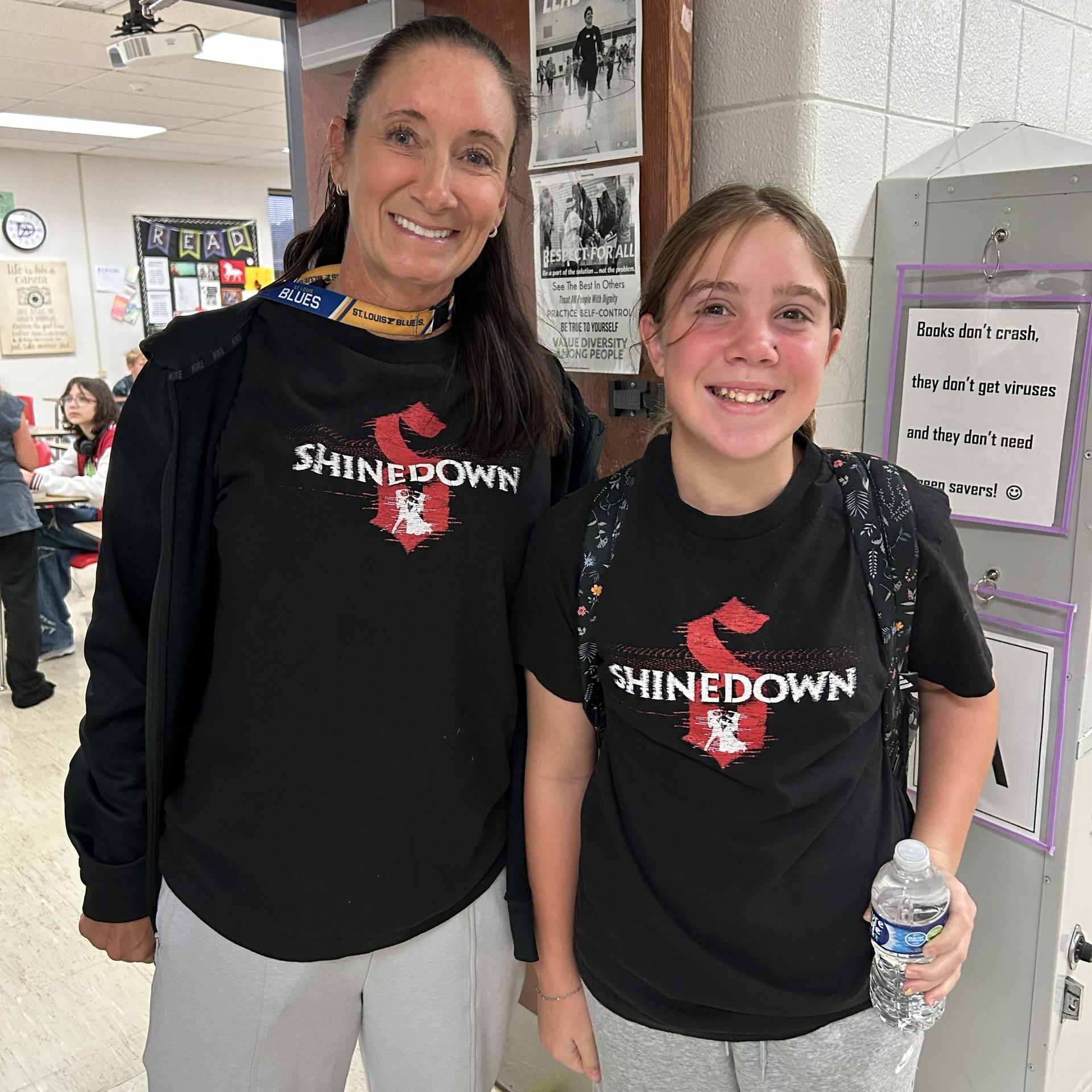 Coach Vanderbol and a student wearing matching T-shirts