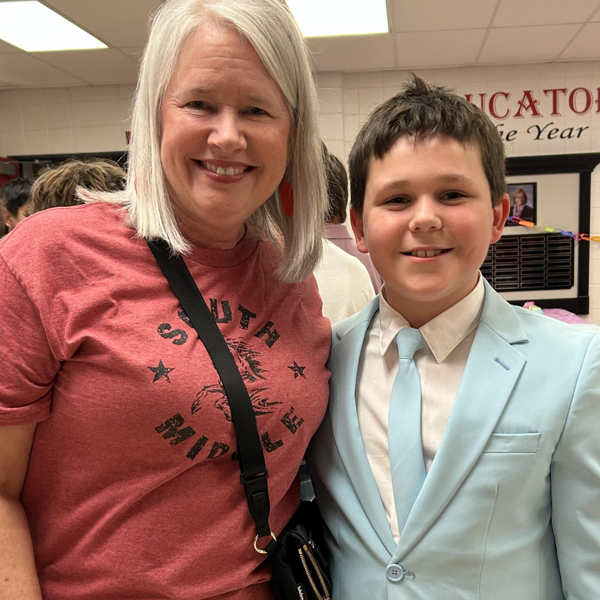 Mrs. Sander and a well dressed student