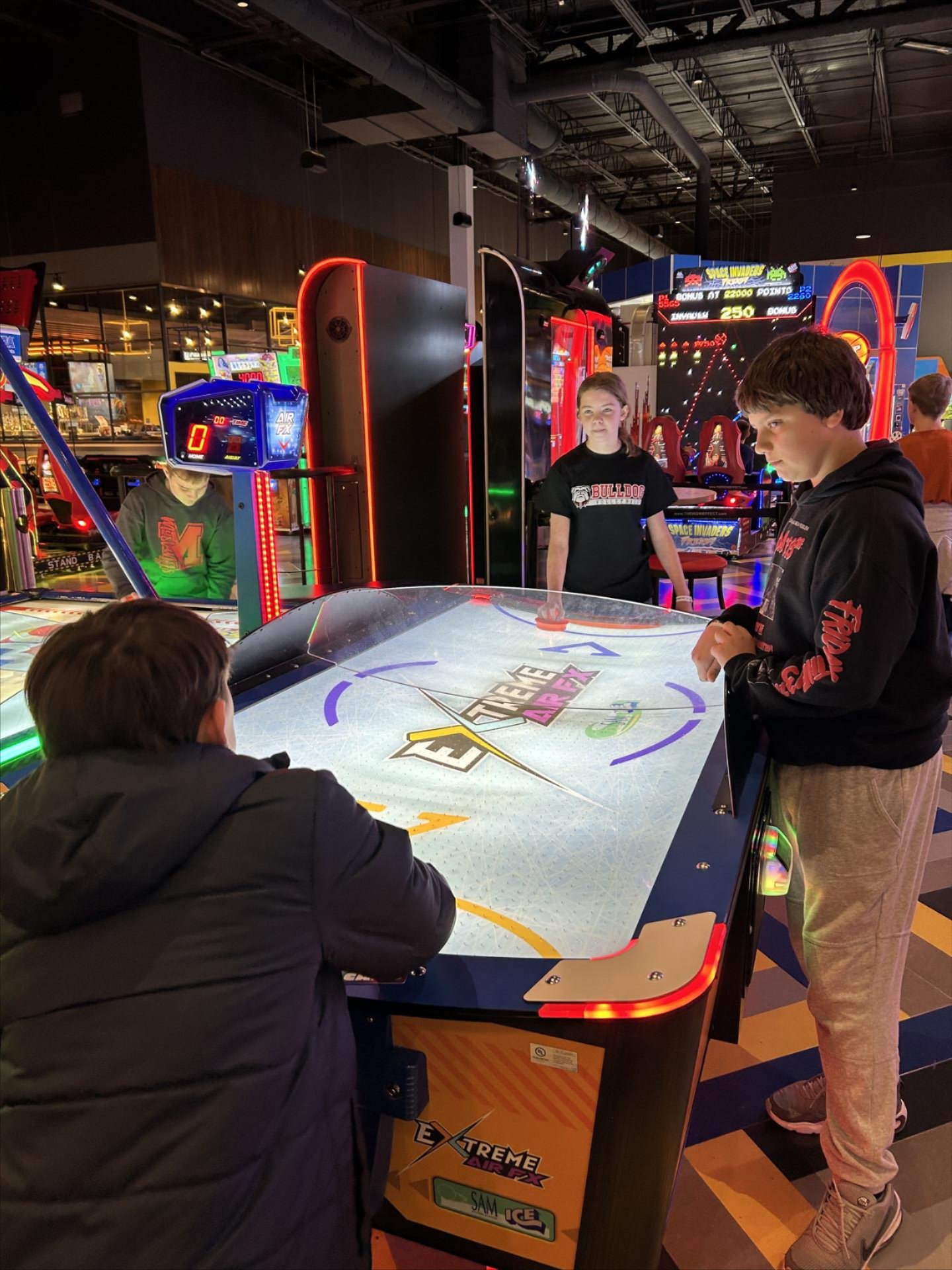 Students playing air hockey