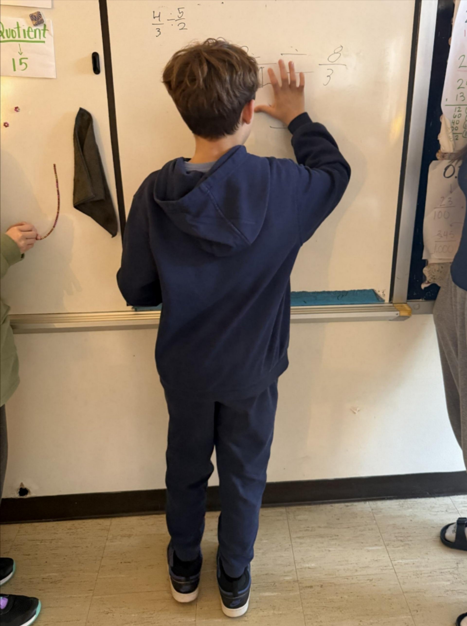 student at the white board 