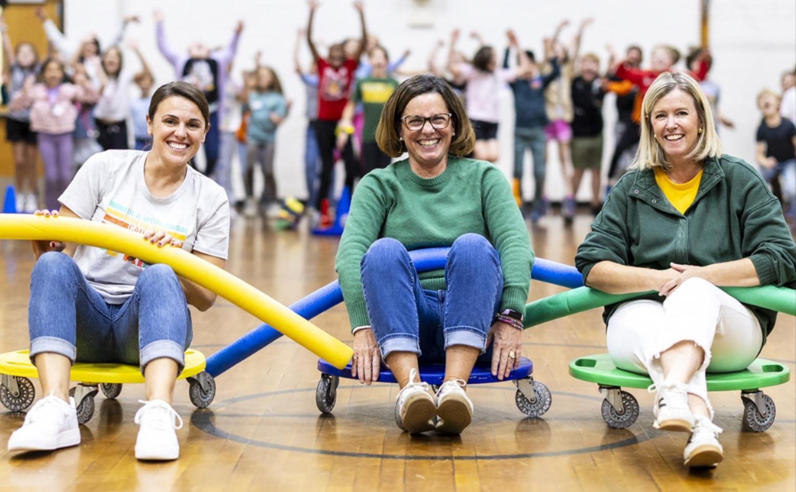 Mrs. Sabbato, Mrs. Amrozowicz and Mrs. Wasneechak in the gym