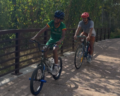 PICTURE OF STUDENTS RIDING THEIR BIKES