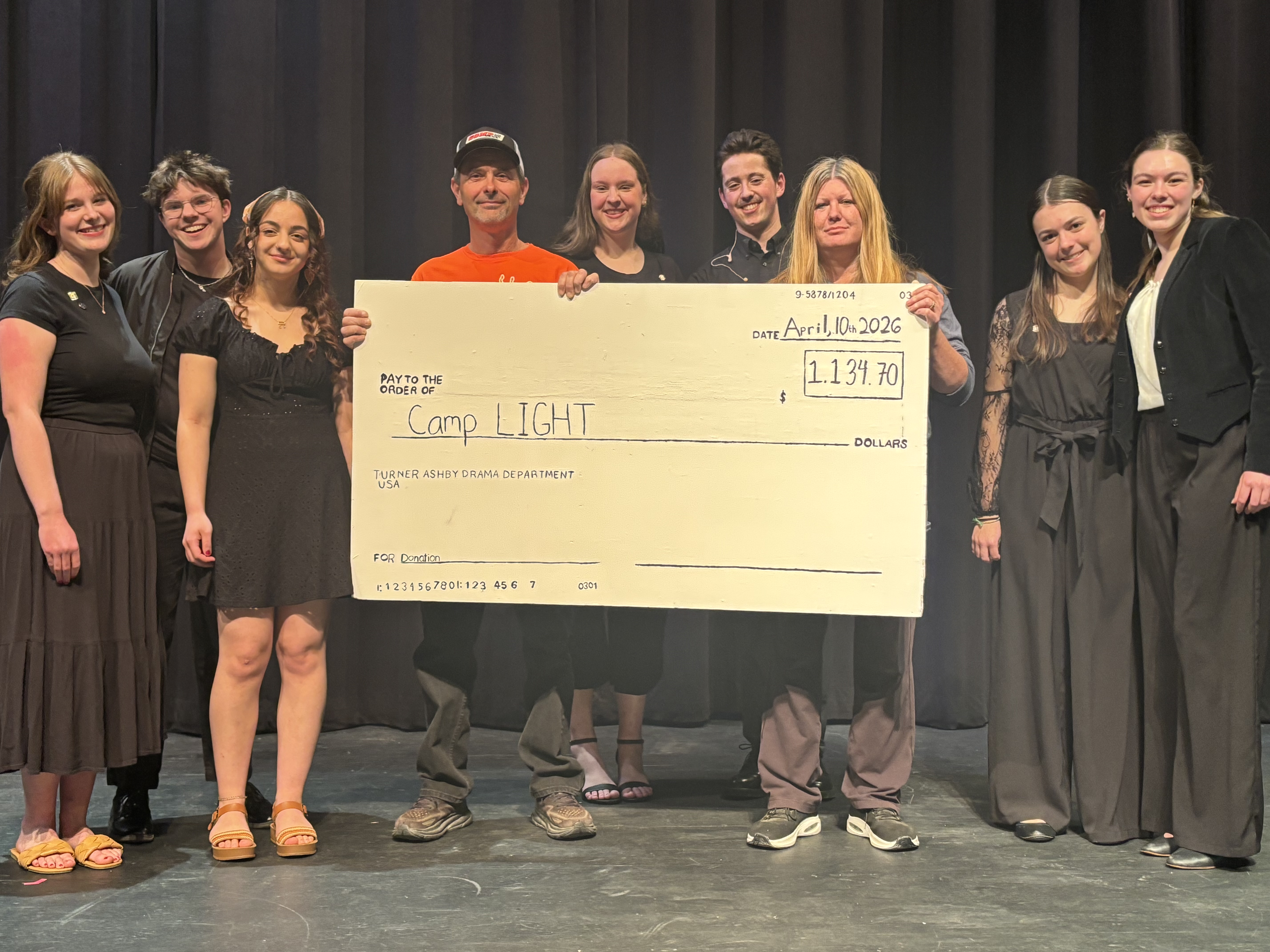 Picture of TAHS Drama Club presenting a check for $1,139 for Camp LIGHT