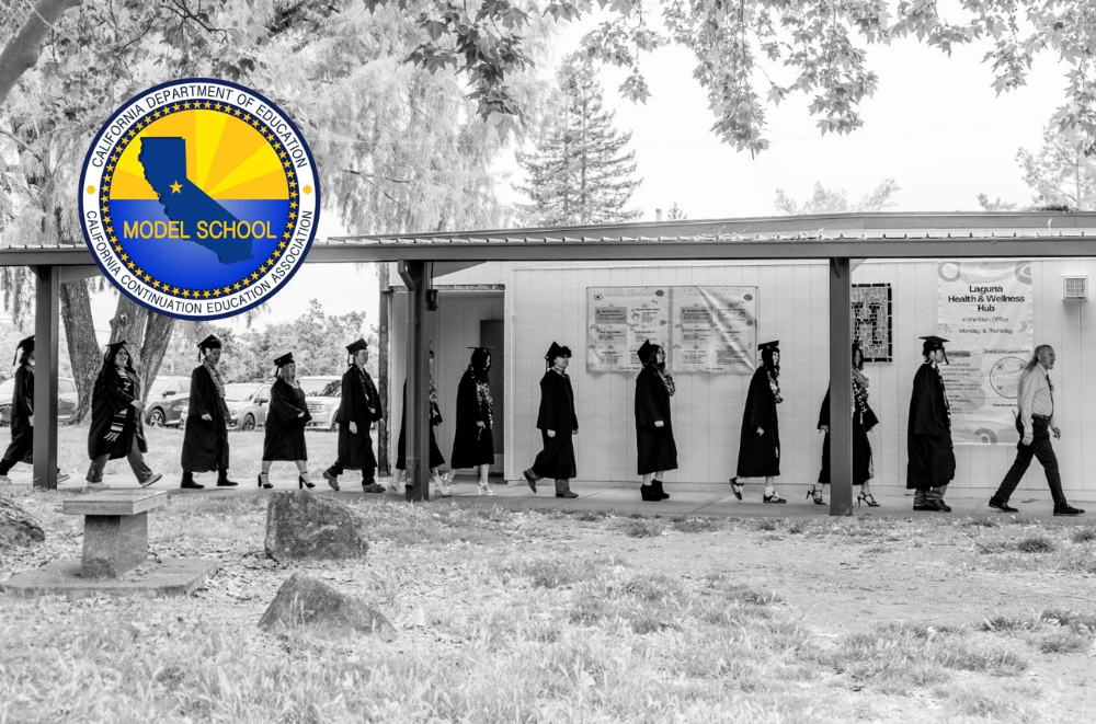 Black and white image of procession of Laguna graduates with color logo for the CDE model School logo