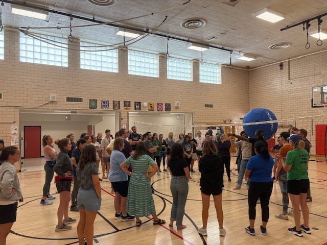 merrill staff playing volleyball