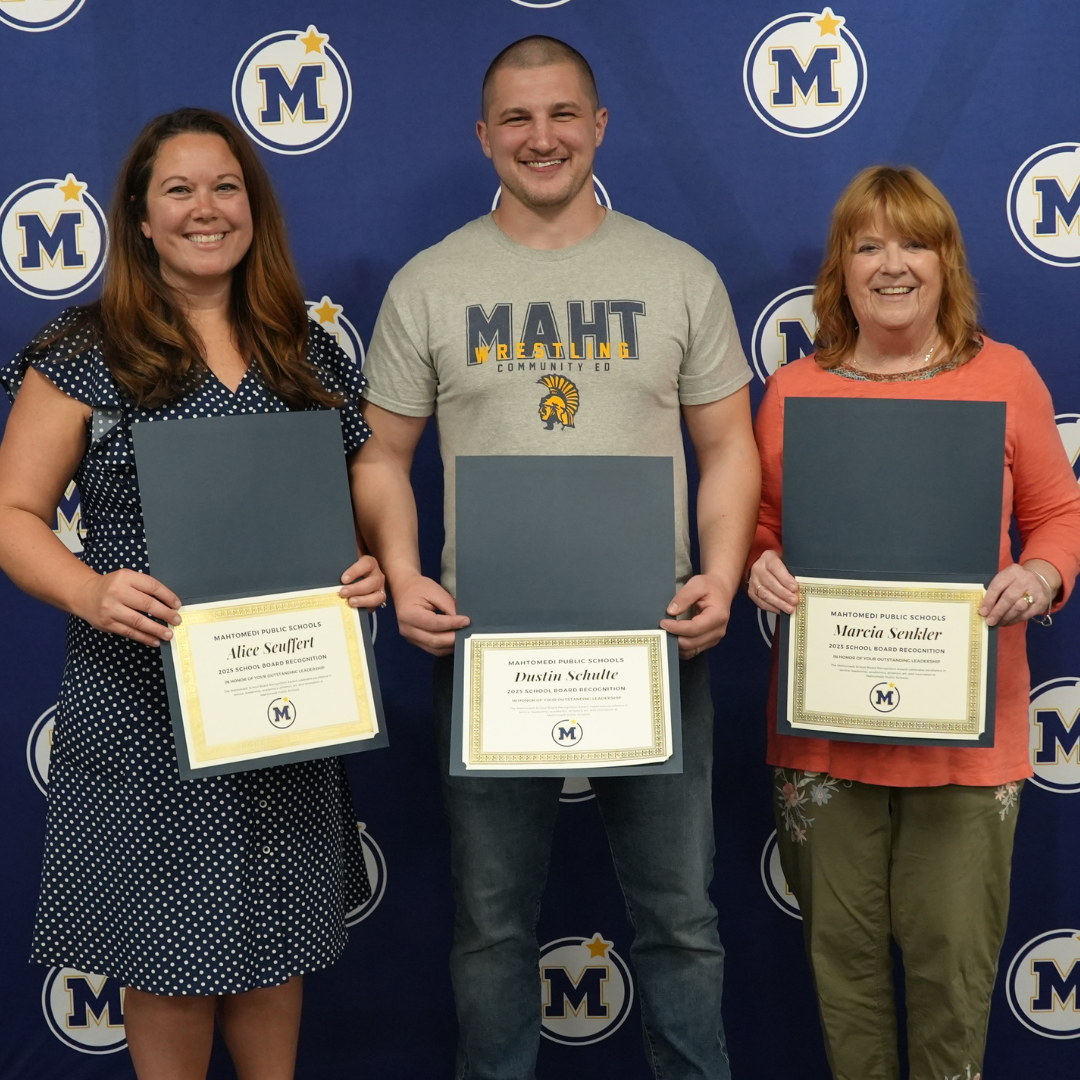 Community Education staff posing with School Board awards 