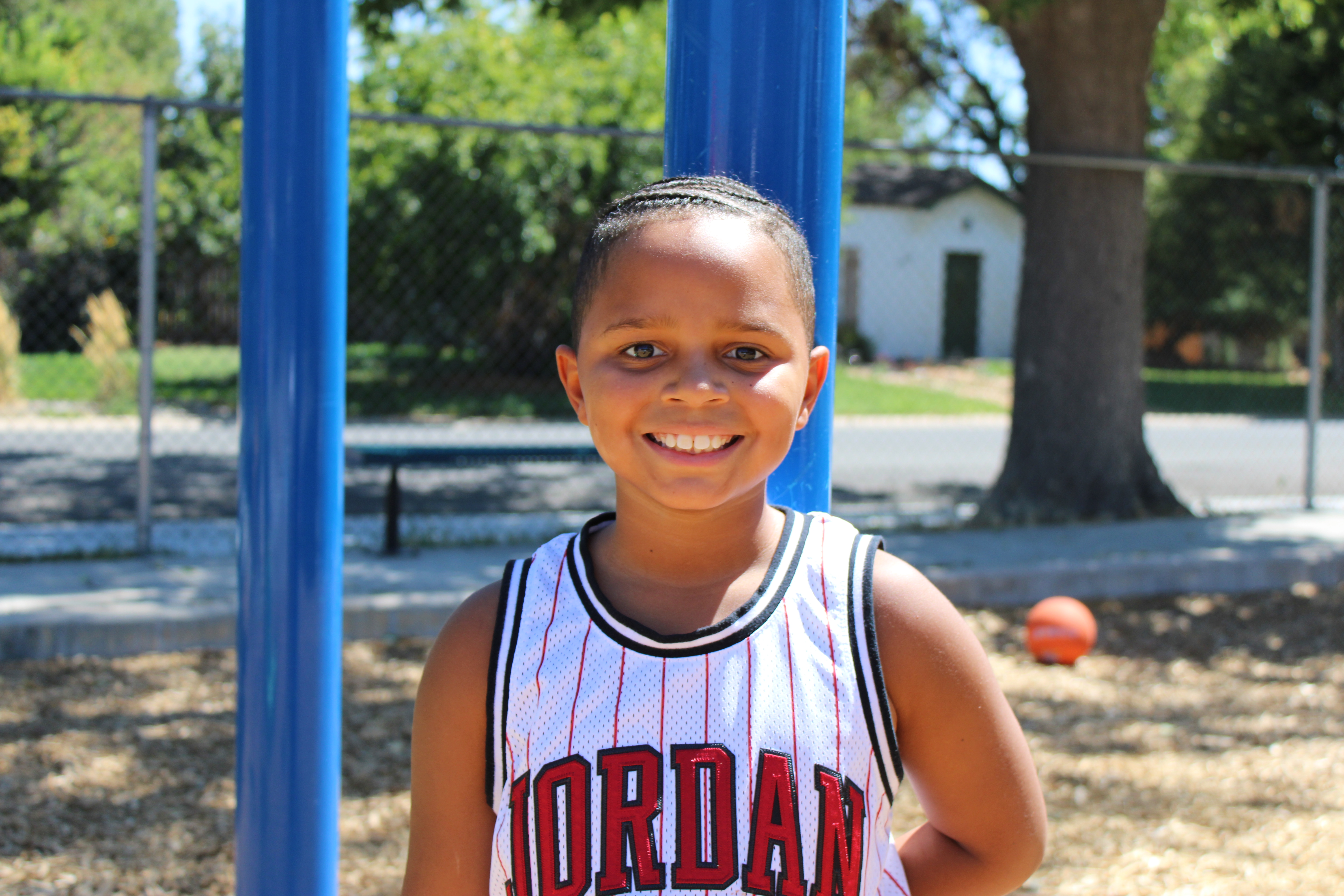 student smiling on the playground