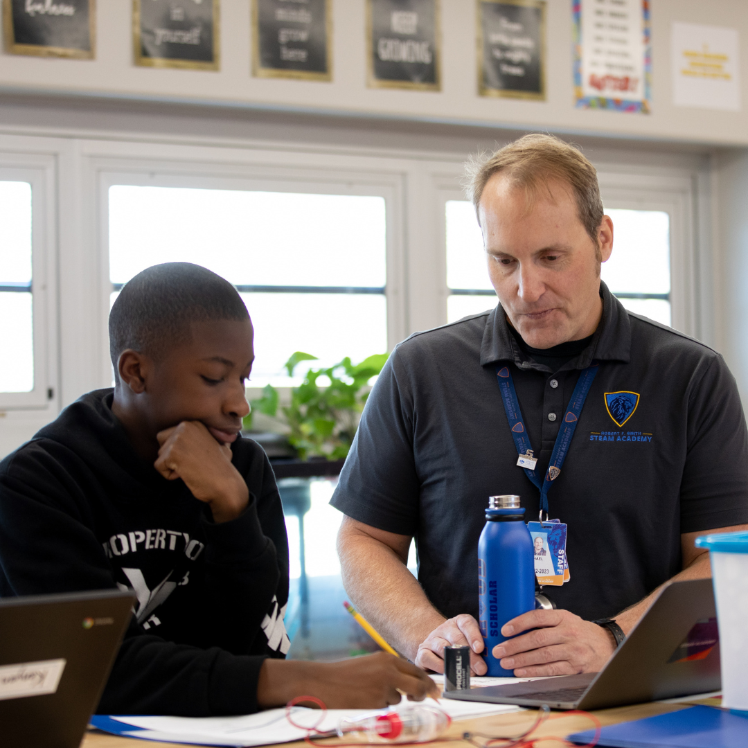 Student and educator reviewing work