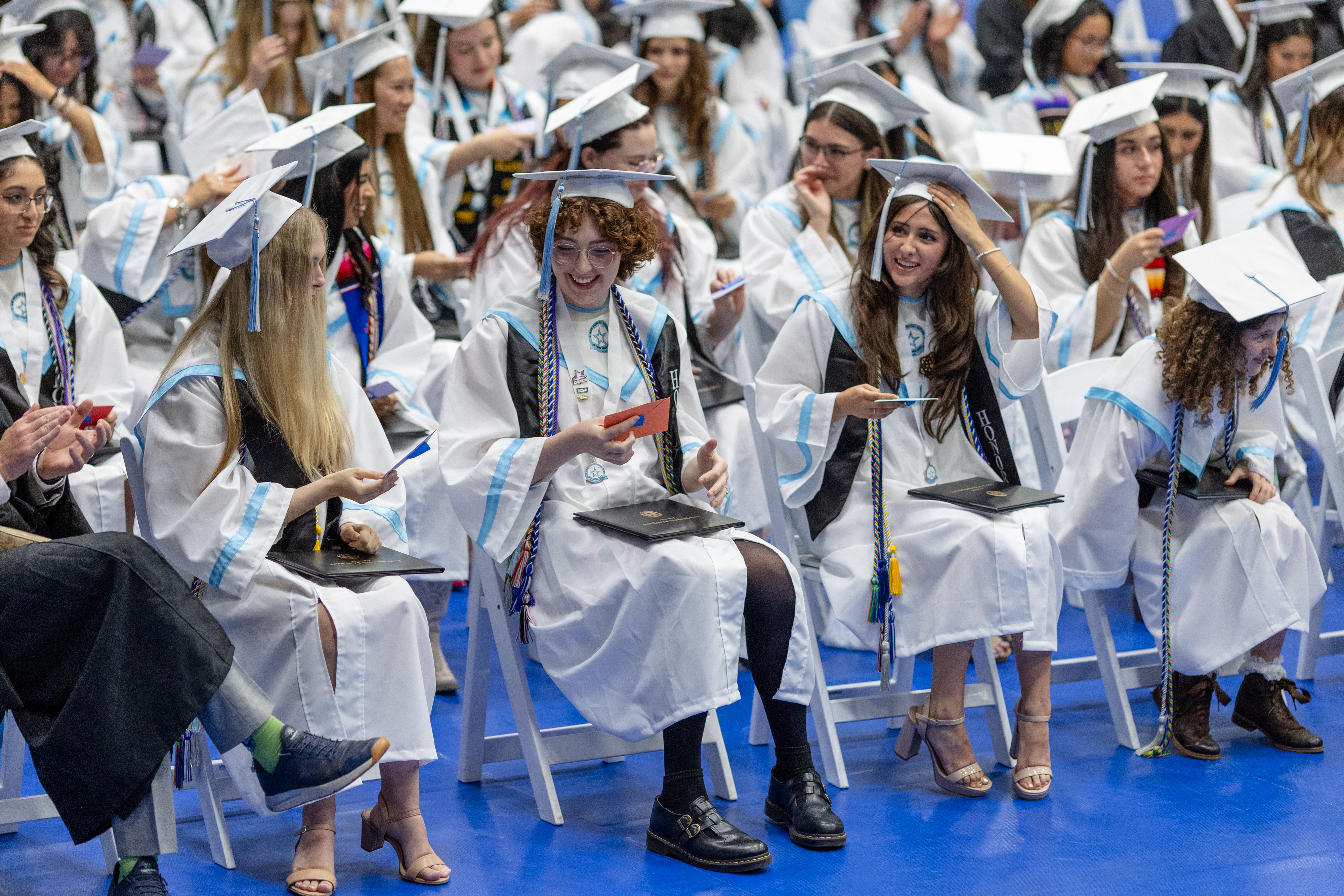 Ann Richards graduates with cao and gowns at their graduation ceremony