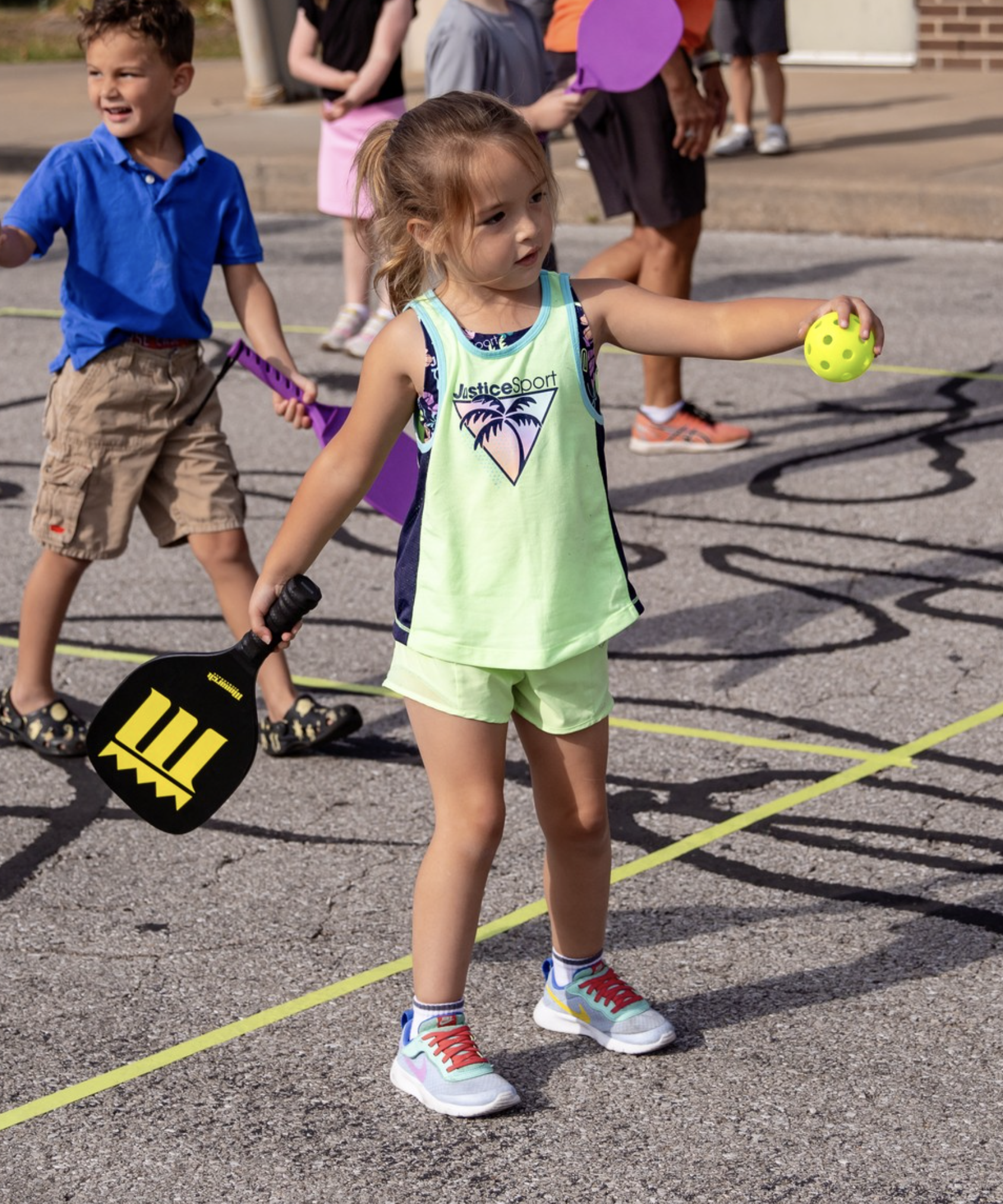 girl pkaying pickleball