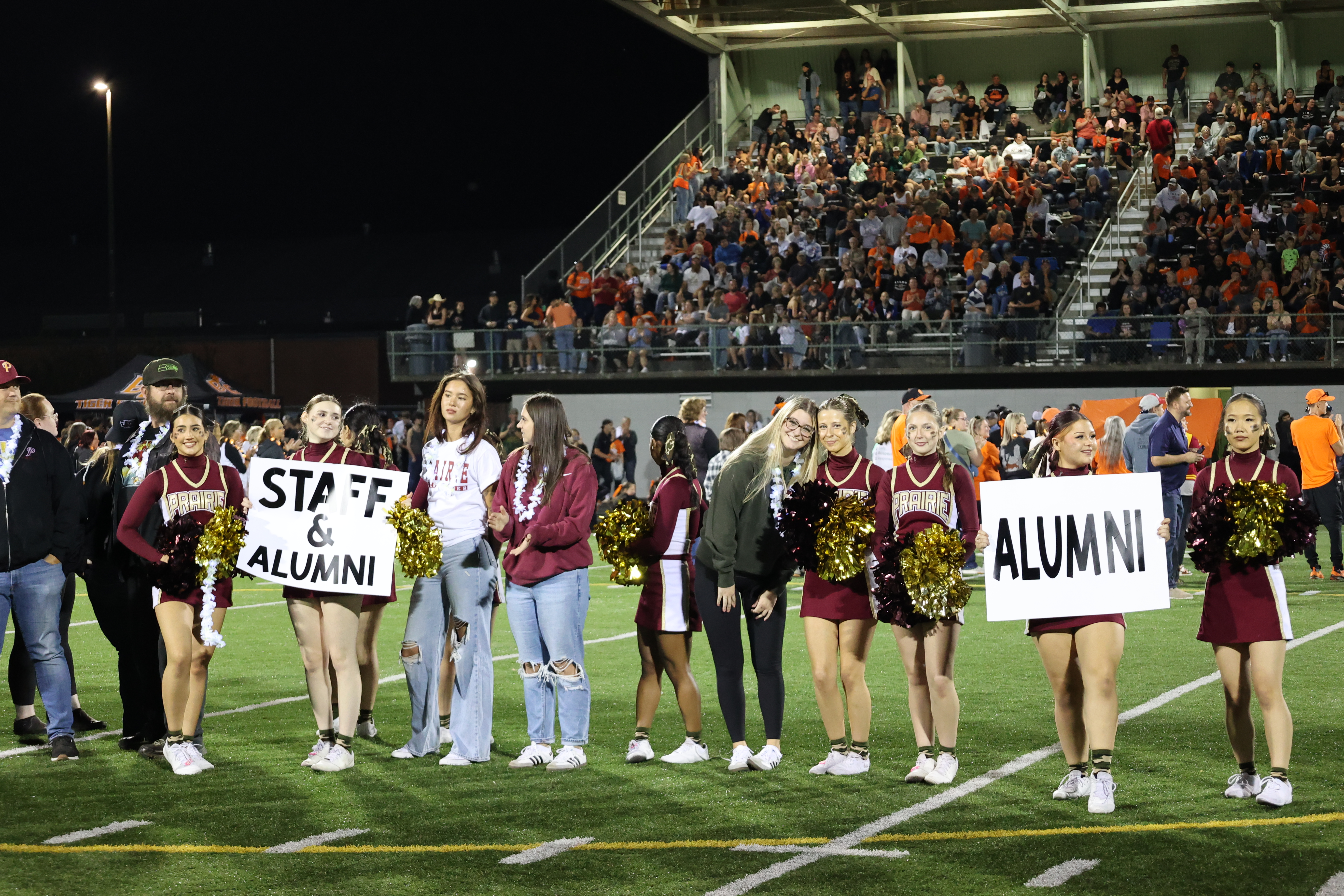A group of alumni pose for a photo at the first ever Battle Ground legacy night