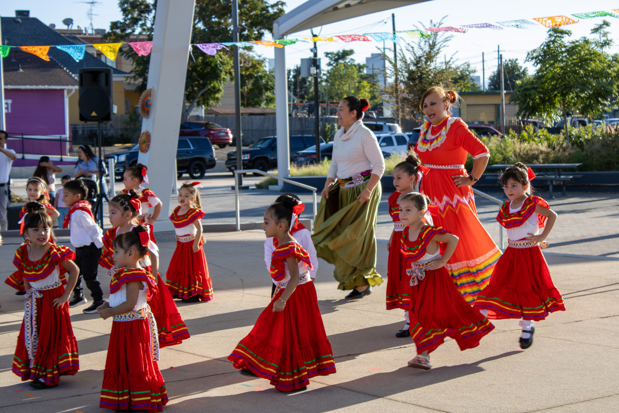 Students perform onstage at Fiesta Hispana in traditional dress.