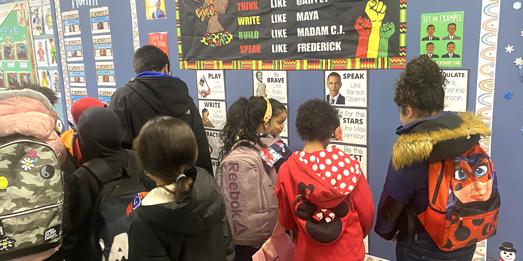 Students viewing Black History Month display