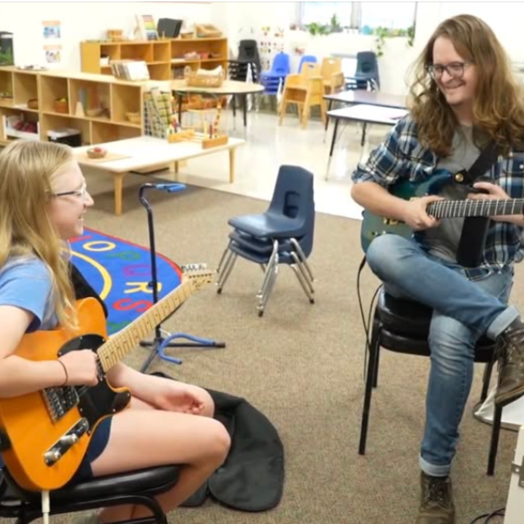 Michael Shumacher teaching guitar lesson to student