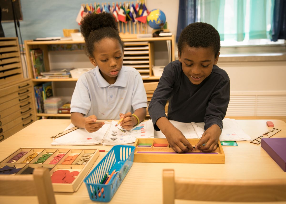 Two students completing math work together