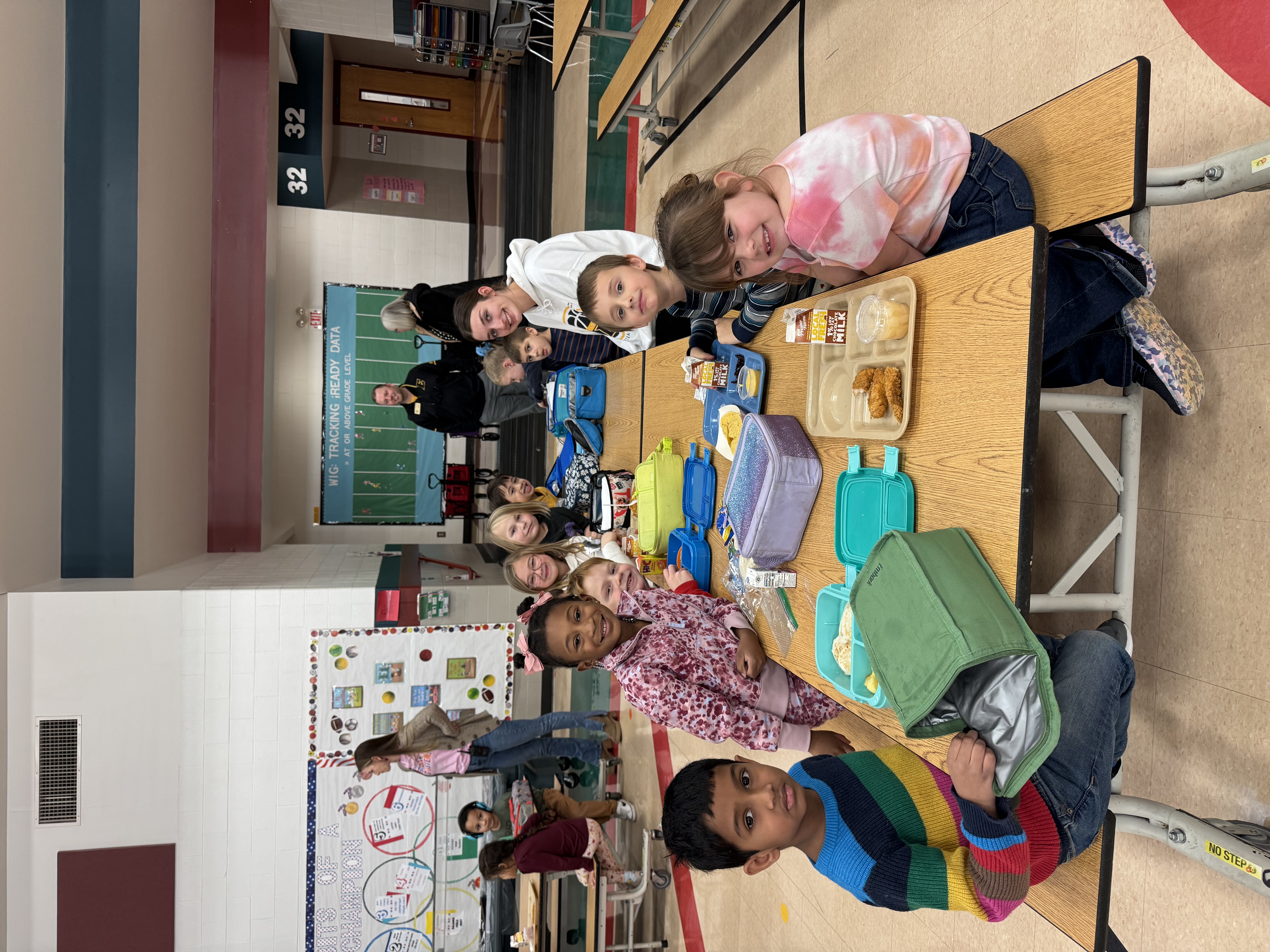 Kindergarten Students and High School leader