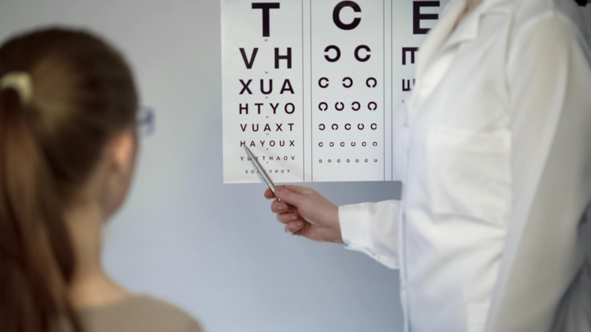 doctor pointing to eye chart