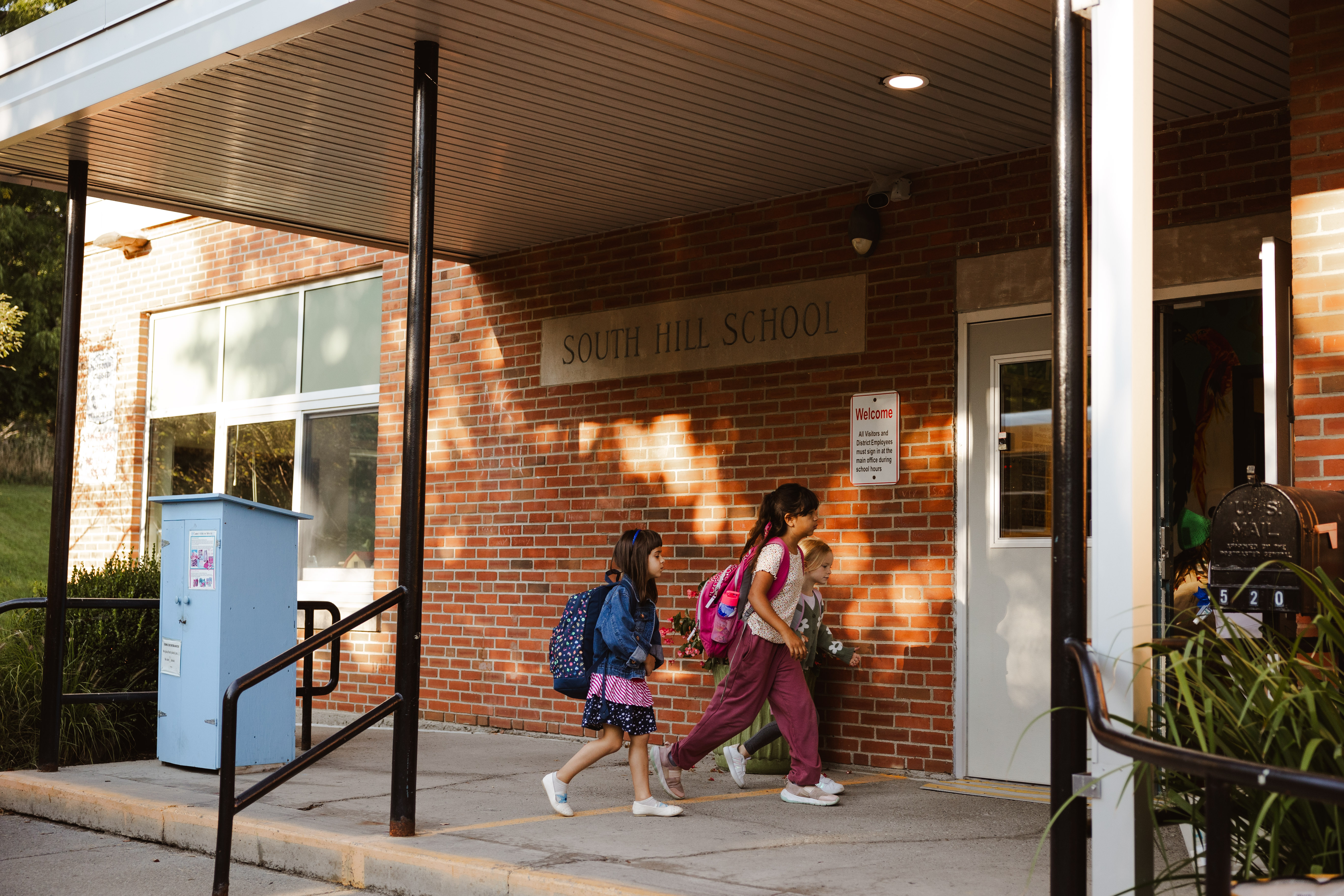 Students entering a school building