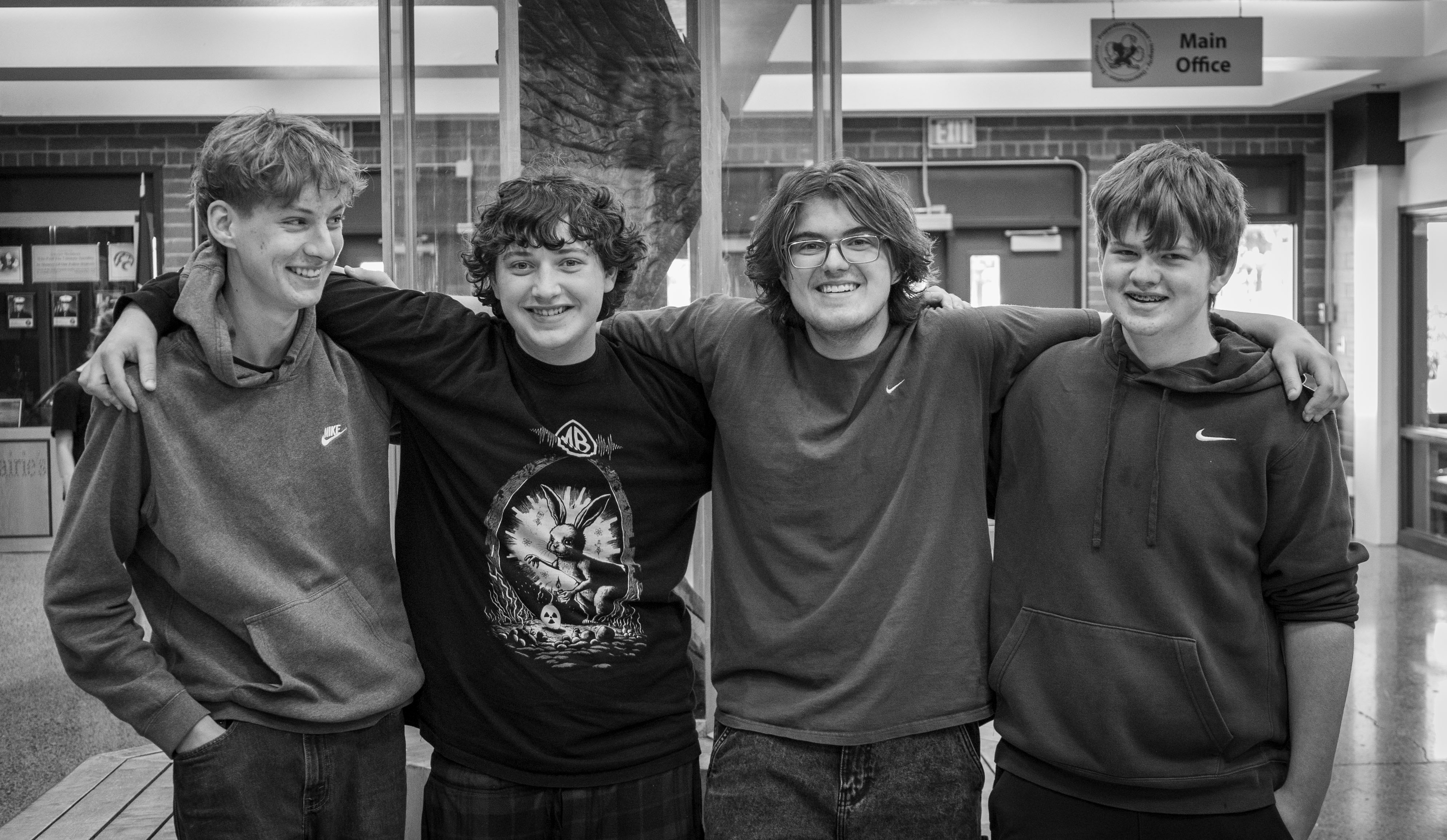 Four high school students pose for a photo