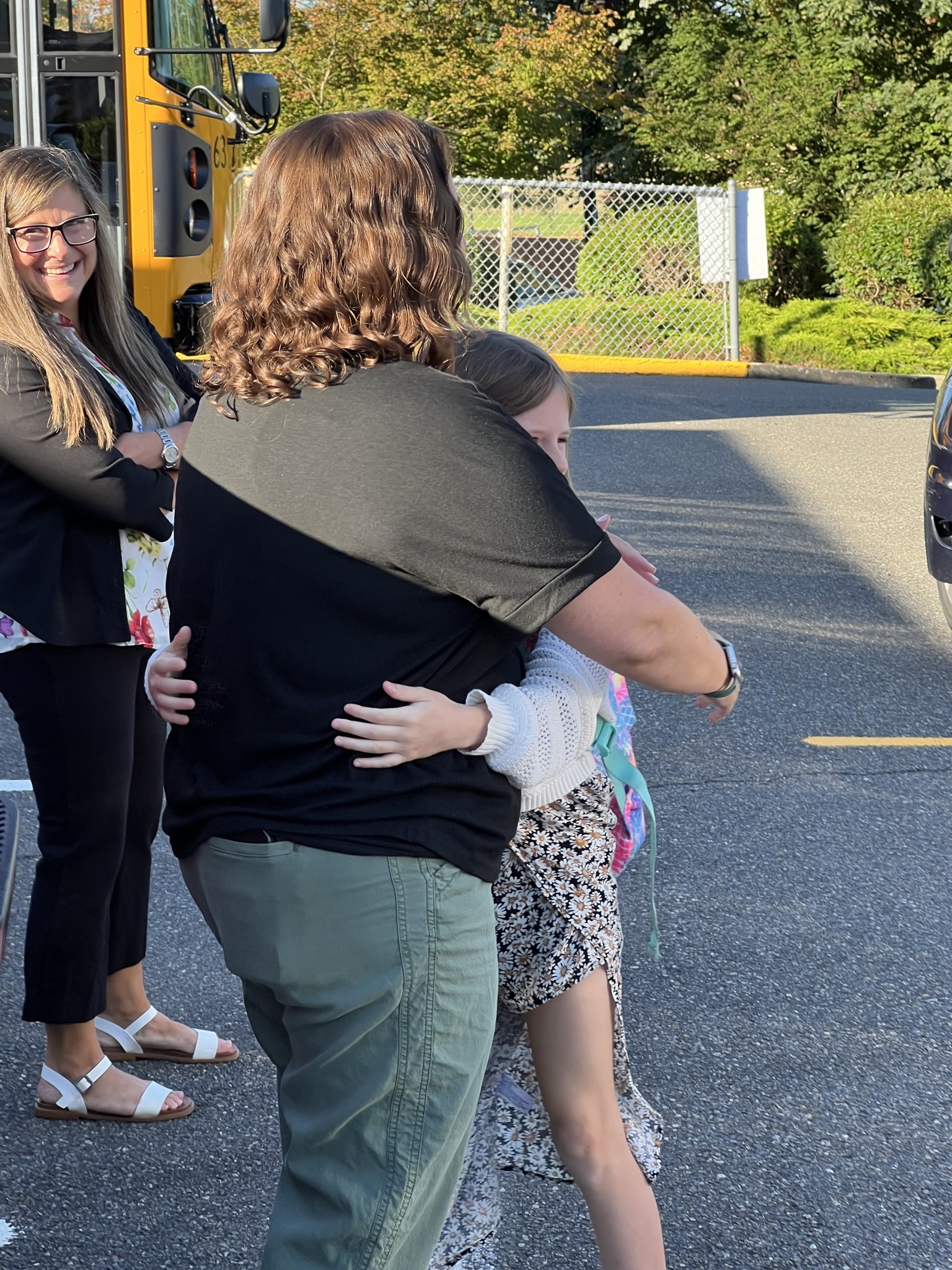 Student hugging staff on first day