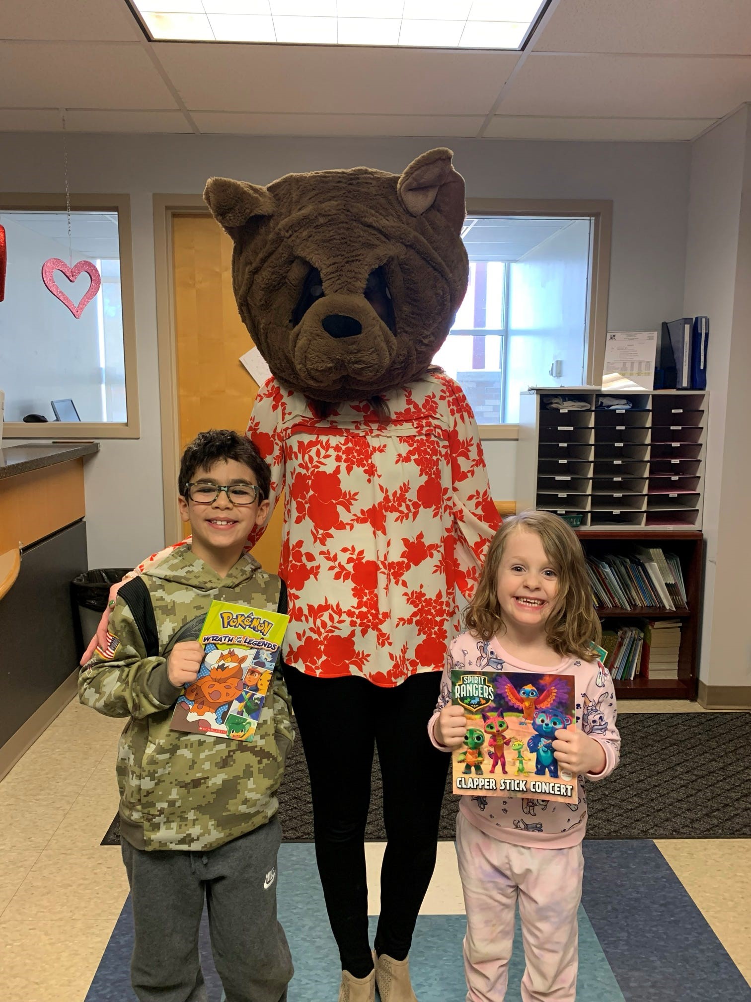 two students with bear