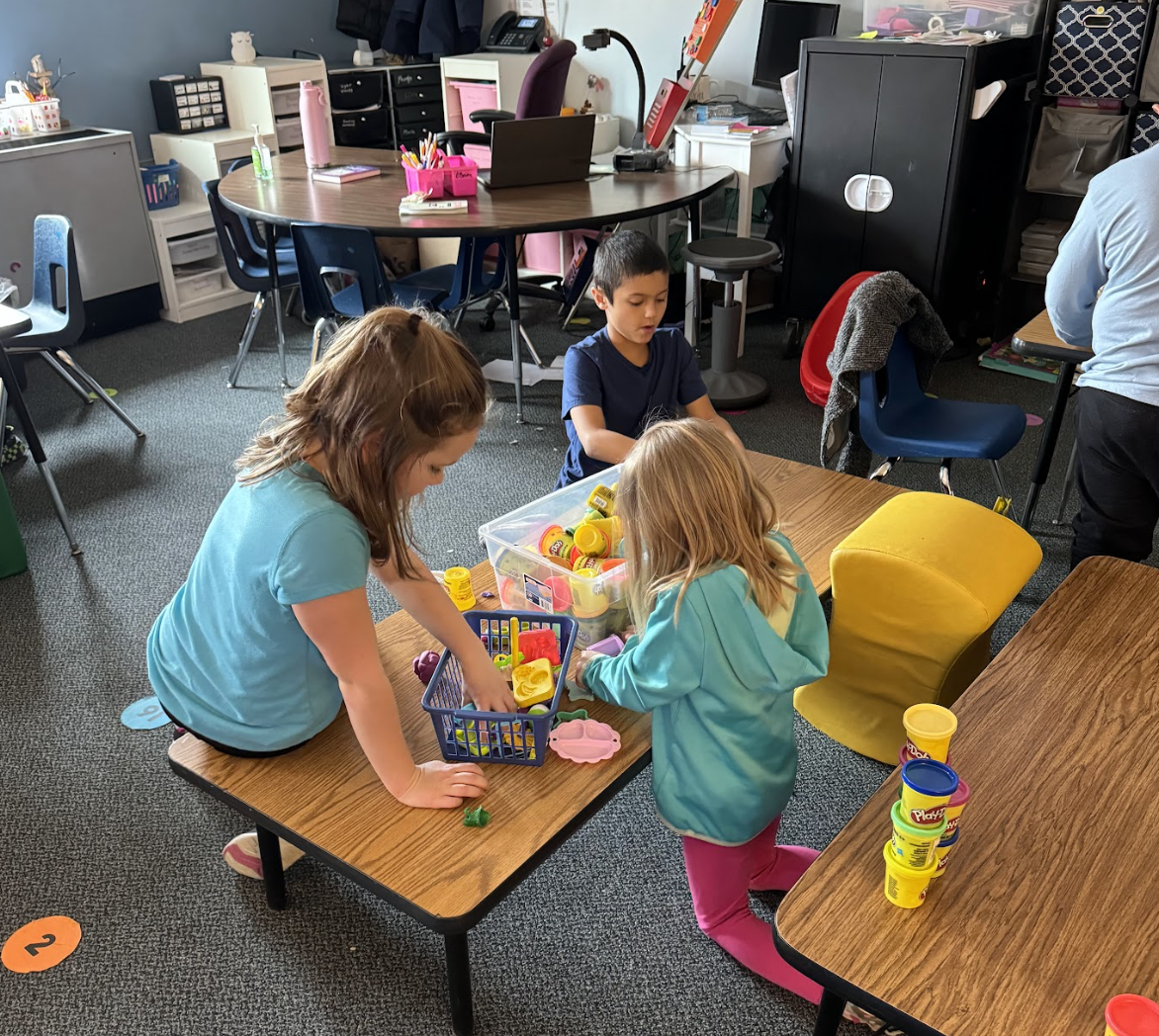 Students playing with play doh