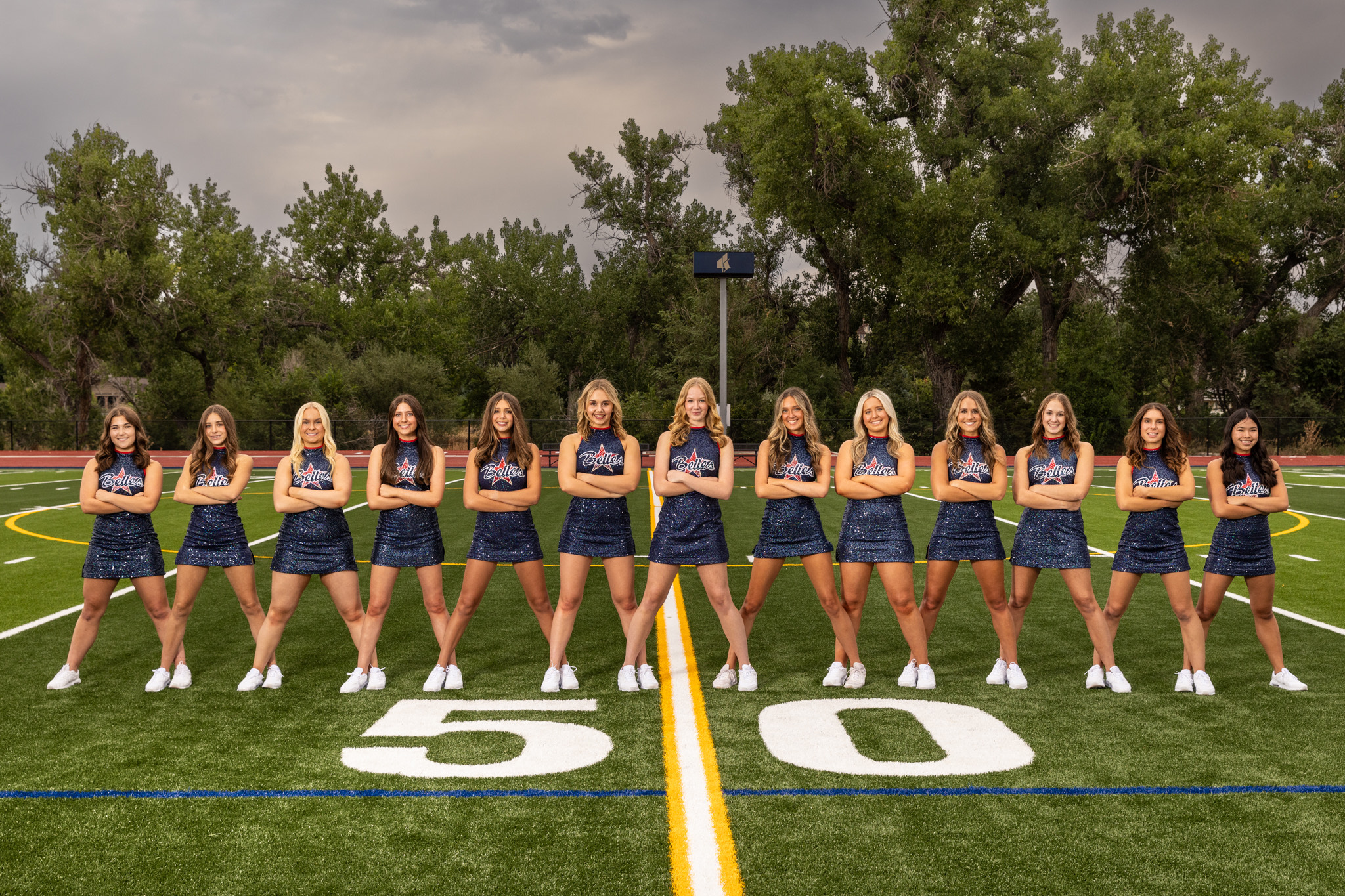 Liberty Belles Dance Team standing on football field