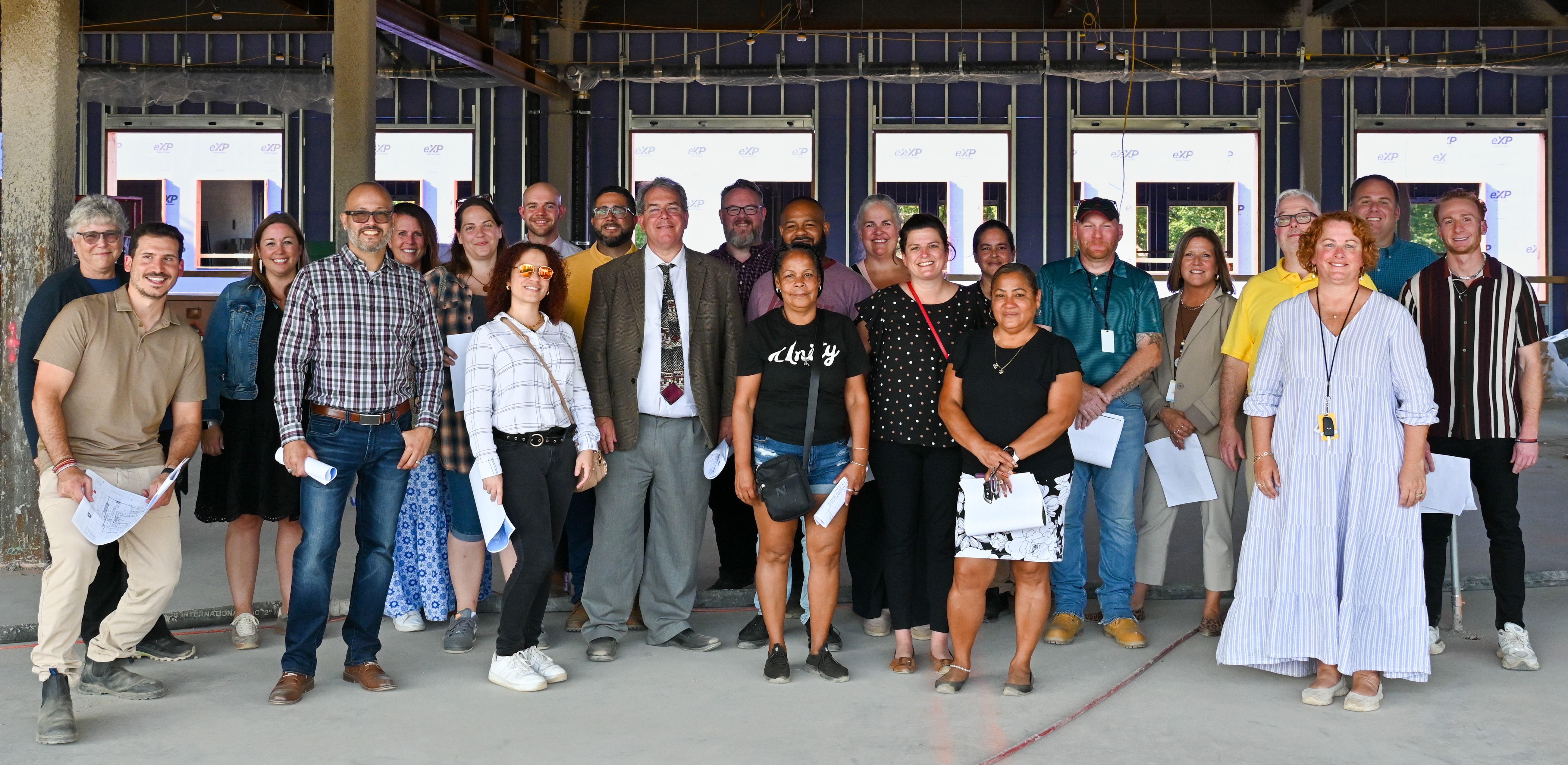 Group photo from a tour of the new middle school construction site