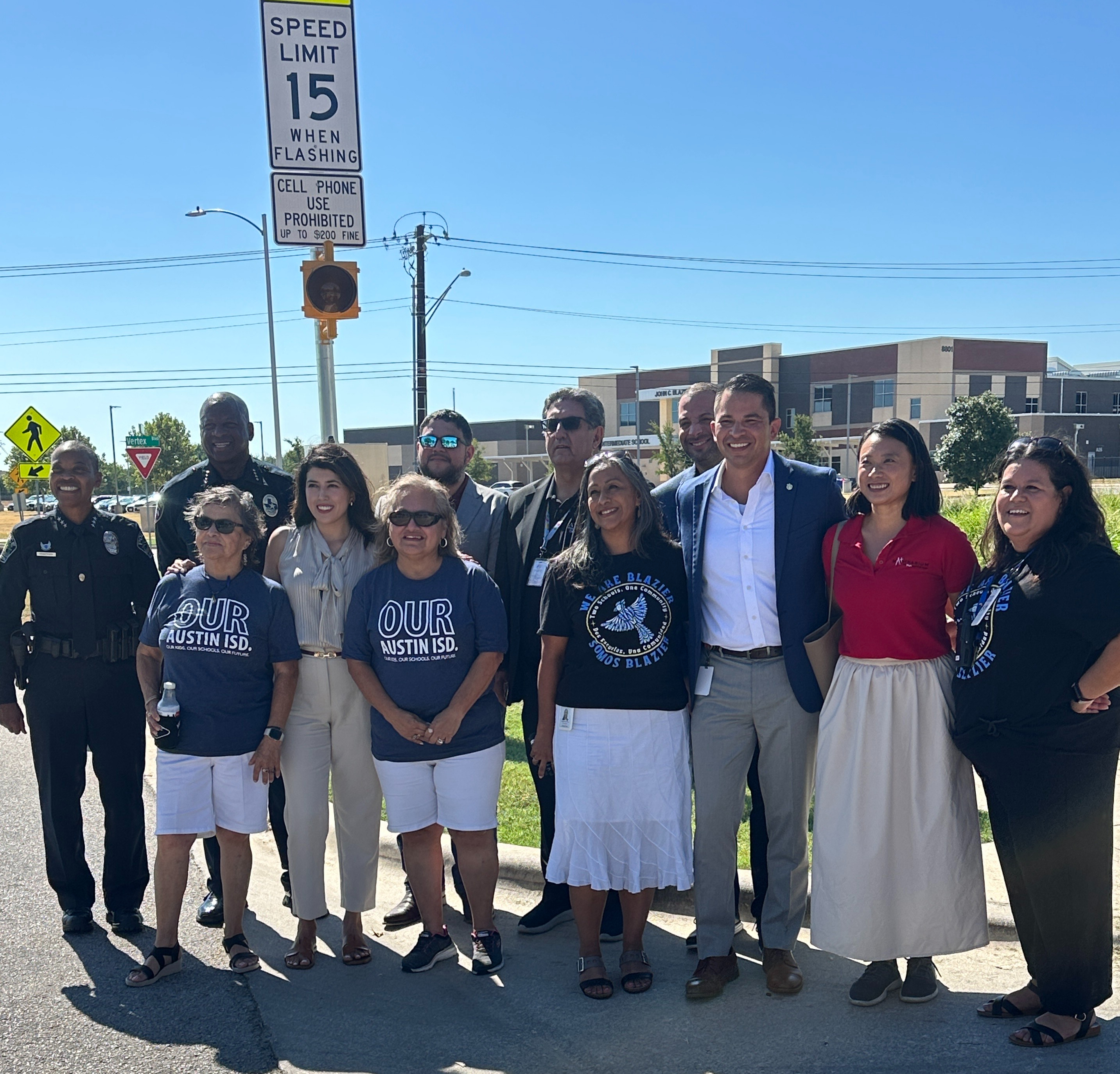 District and city leaders gather to celebrate new school zone beacons.