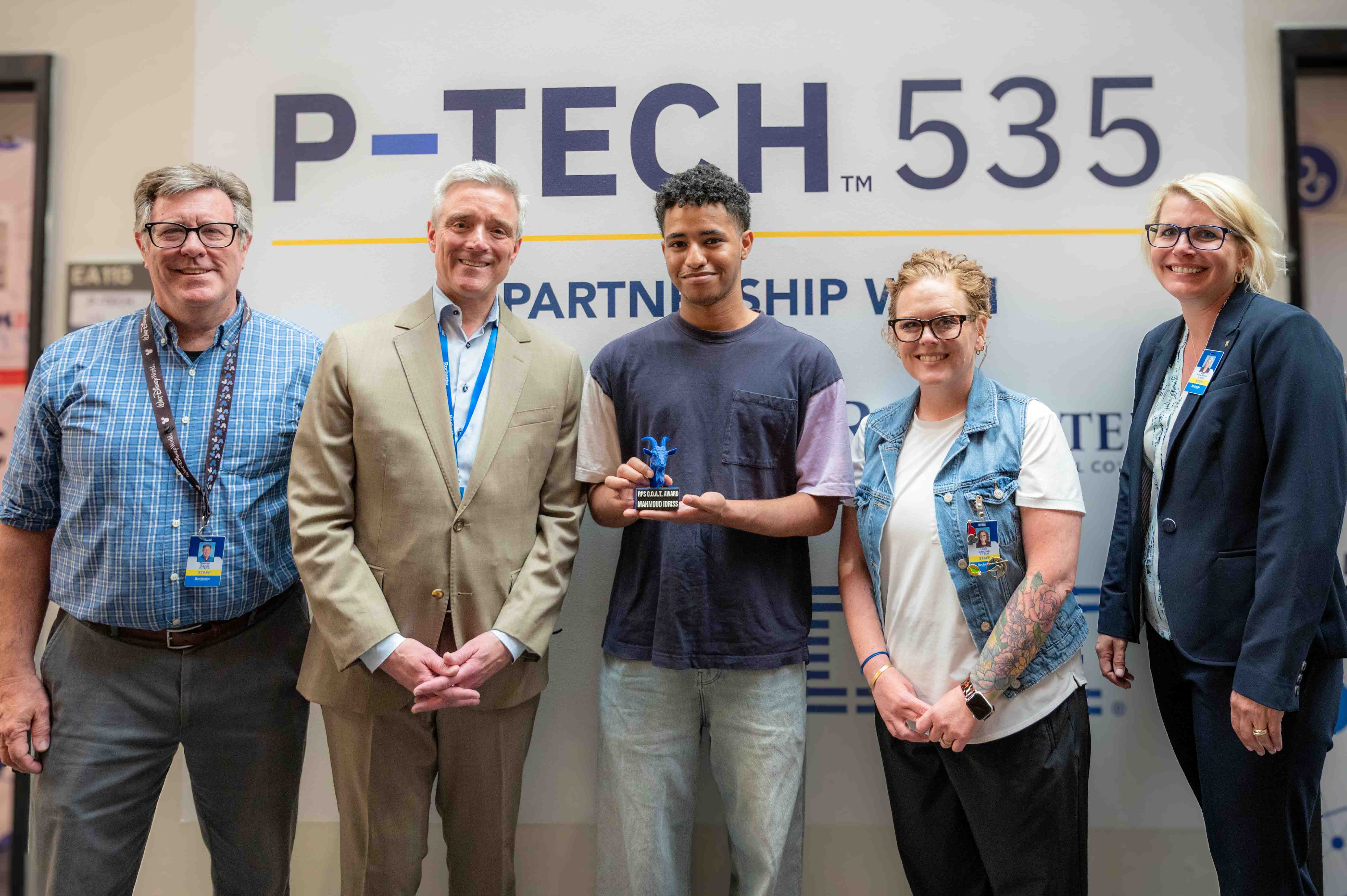 Mahmoud Idriss, PTECH student receiving the GOAT Award
